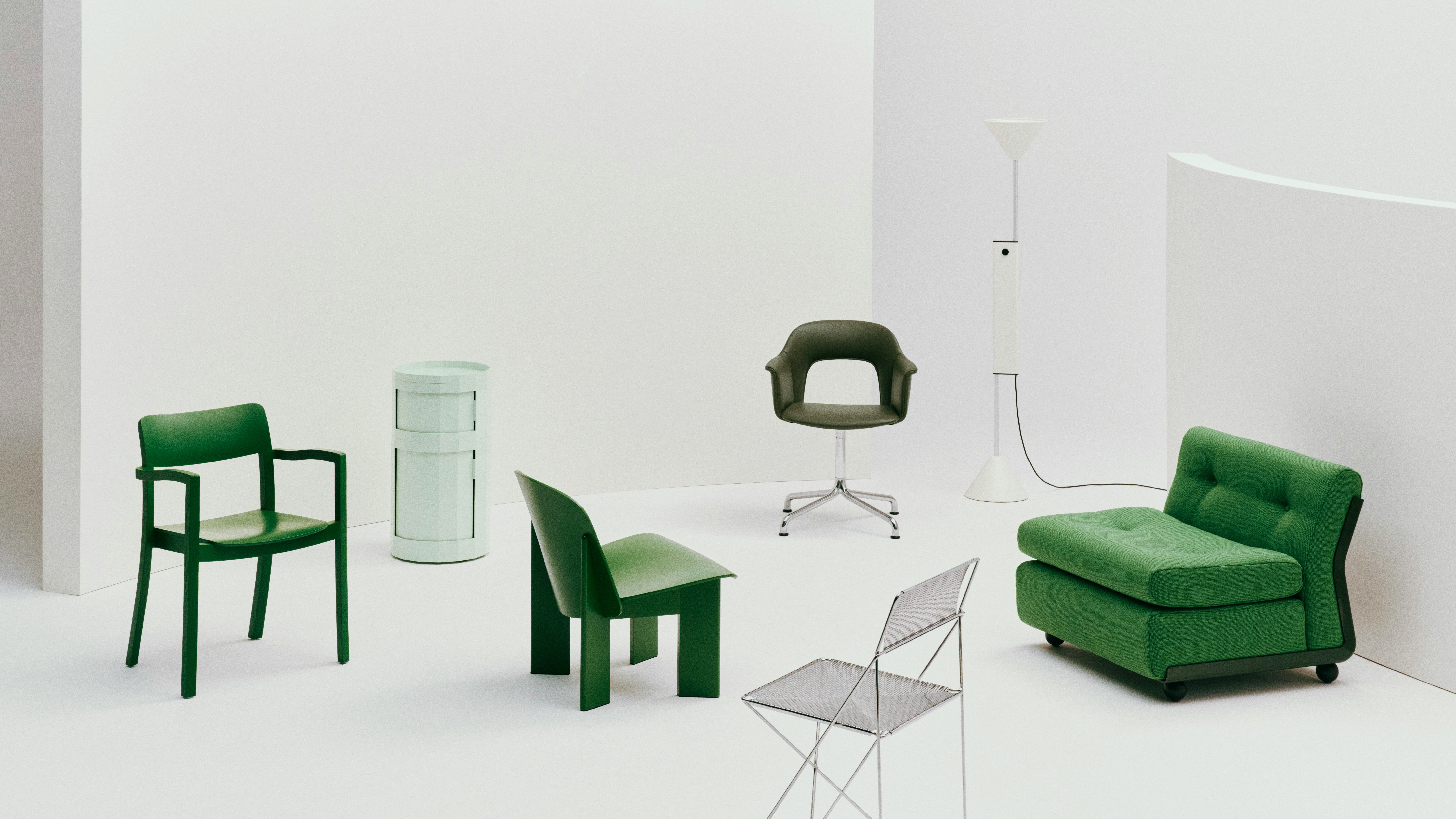 Green HAY products including Chisel Lounge Chair, Amanta Sofa, Facet Cabinet, Layout Armchair, and X-Line Chair arranged on a white backdrop.