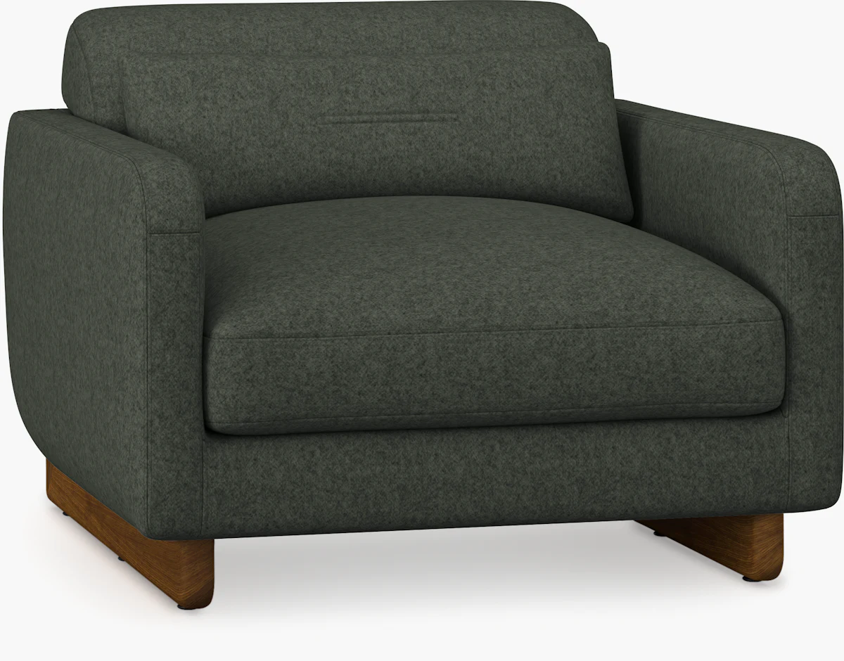 Front view of matching olive green upholstered chair with wooden legs.