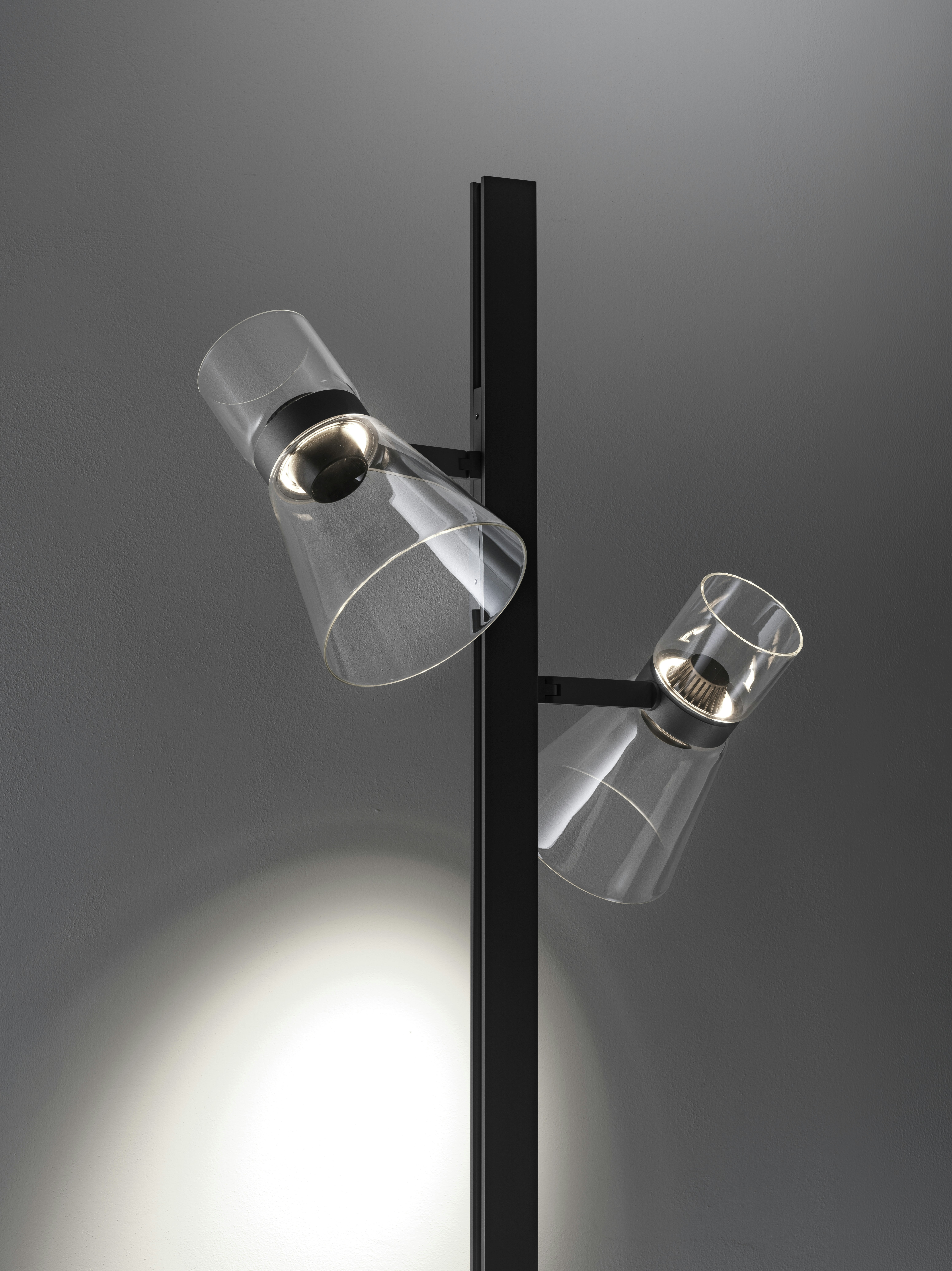 An environmental shot of Nocturne Floor Lamp in F2 Cone, Black.