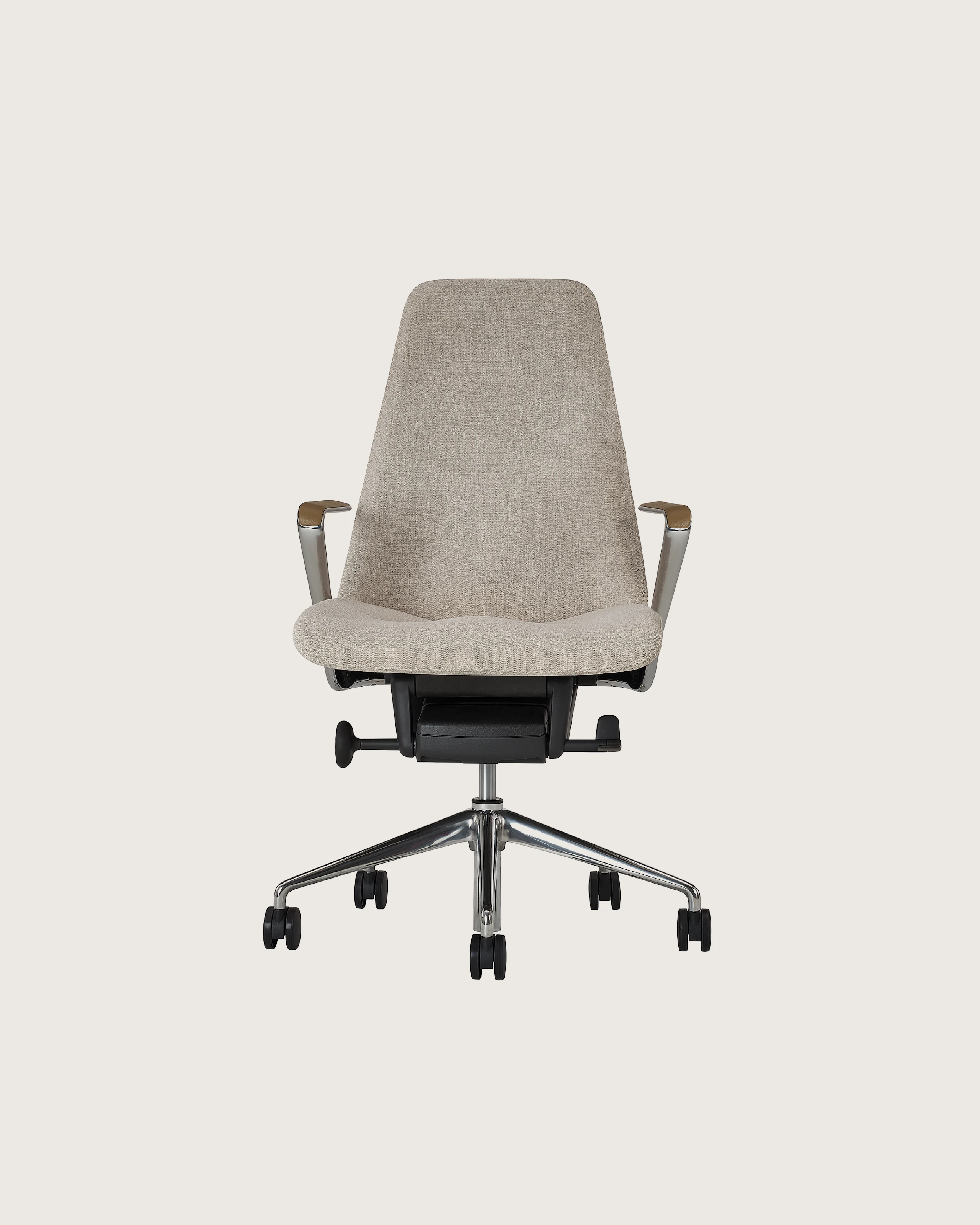 Taper Chair designed by Mark Goetz upholstered in Ingenue in Sand Mix with leather arm pads in Prone Leather in Burlap and a polished chrome base, shown front-facing on a white sweep.