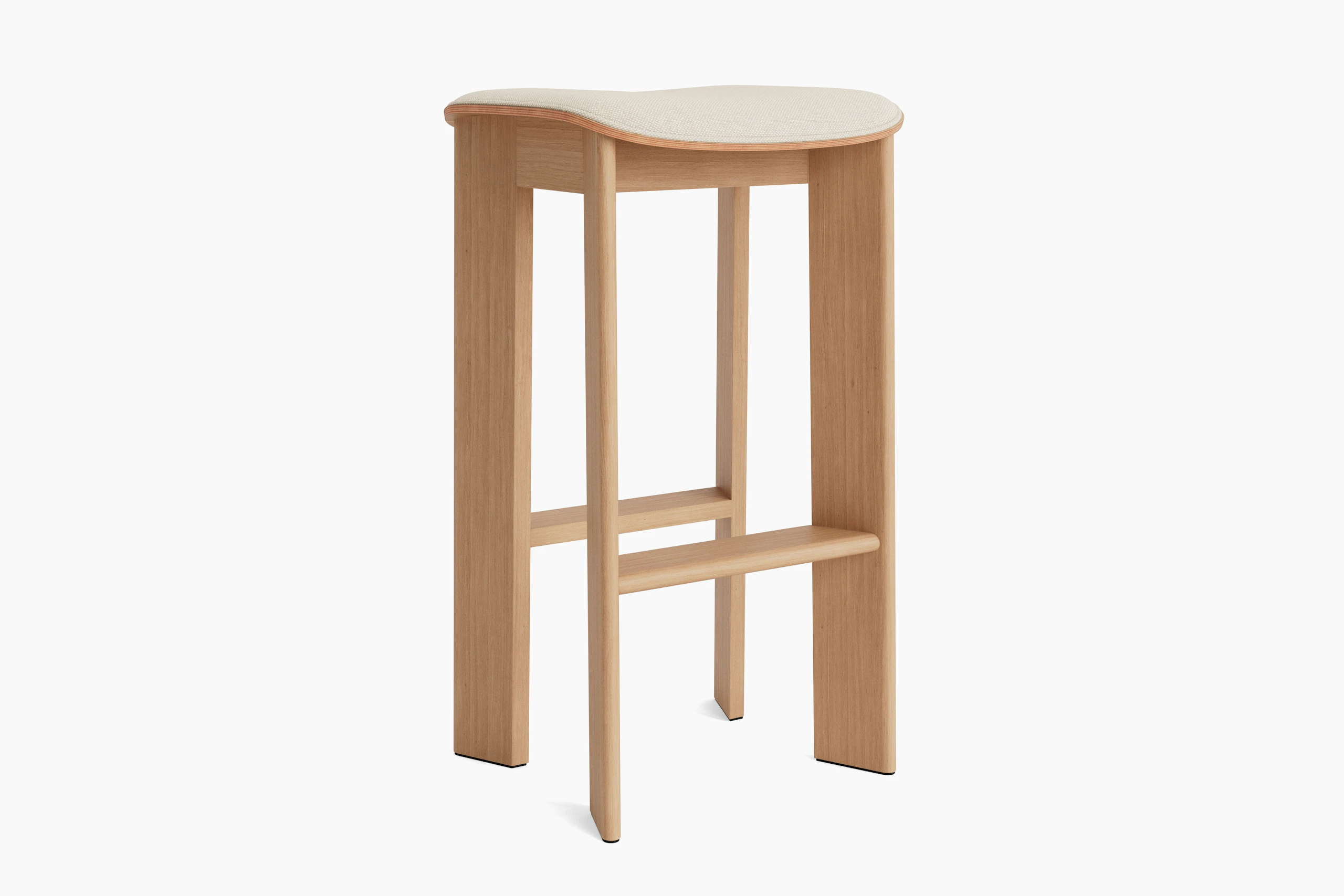 Chisel bar stool in oak with upholstery, angled view