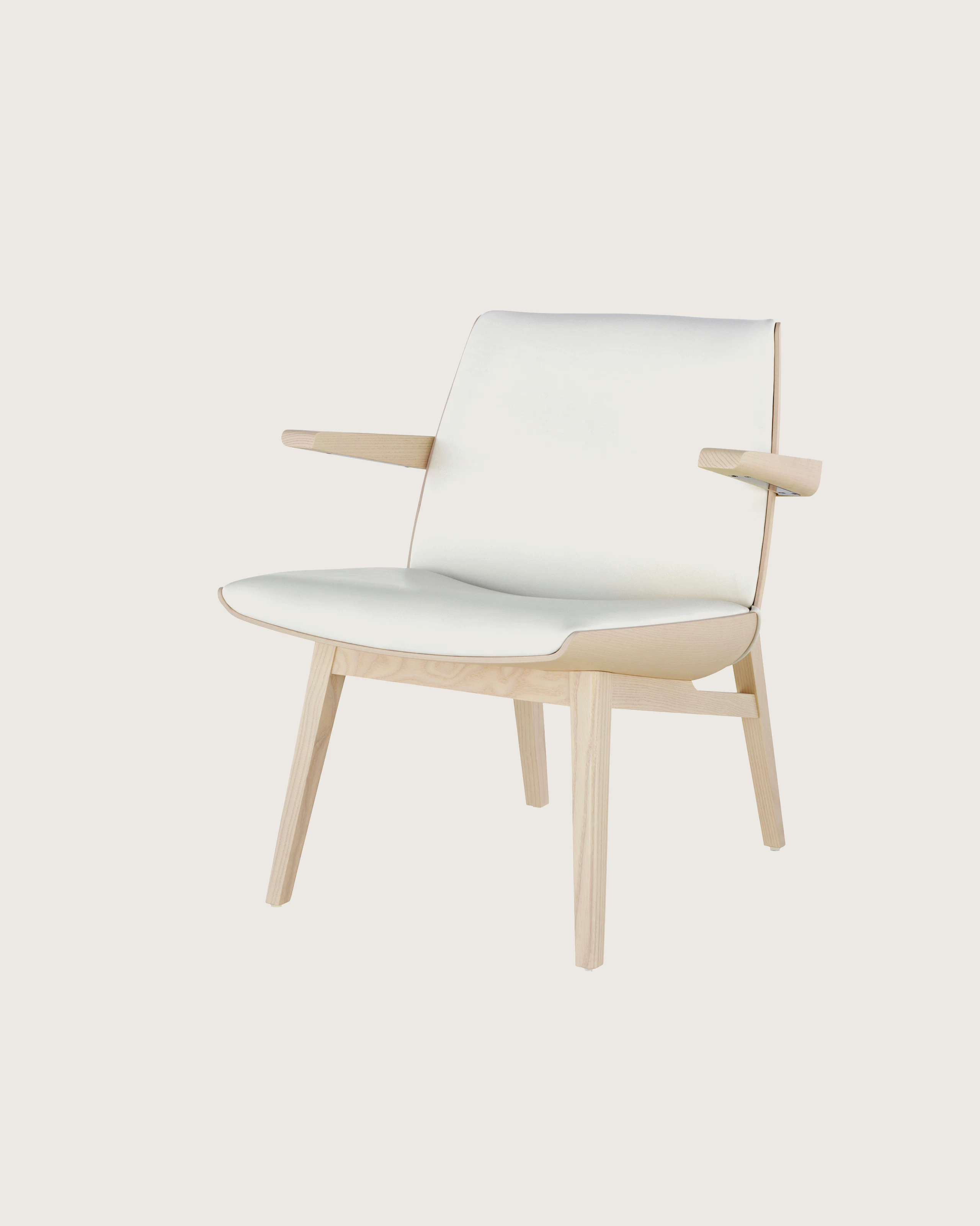 Angled view of a low-back Clamshell Lounge Chair with off-white fabric upholstery and light-ash legs.
