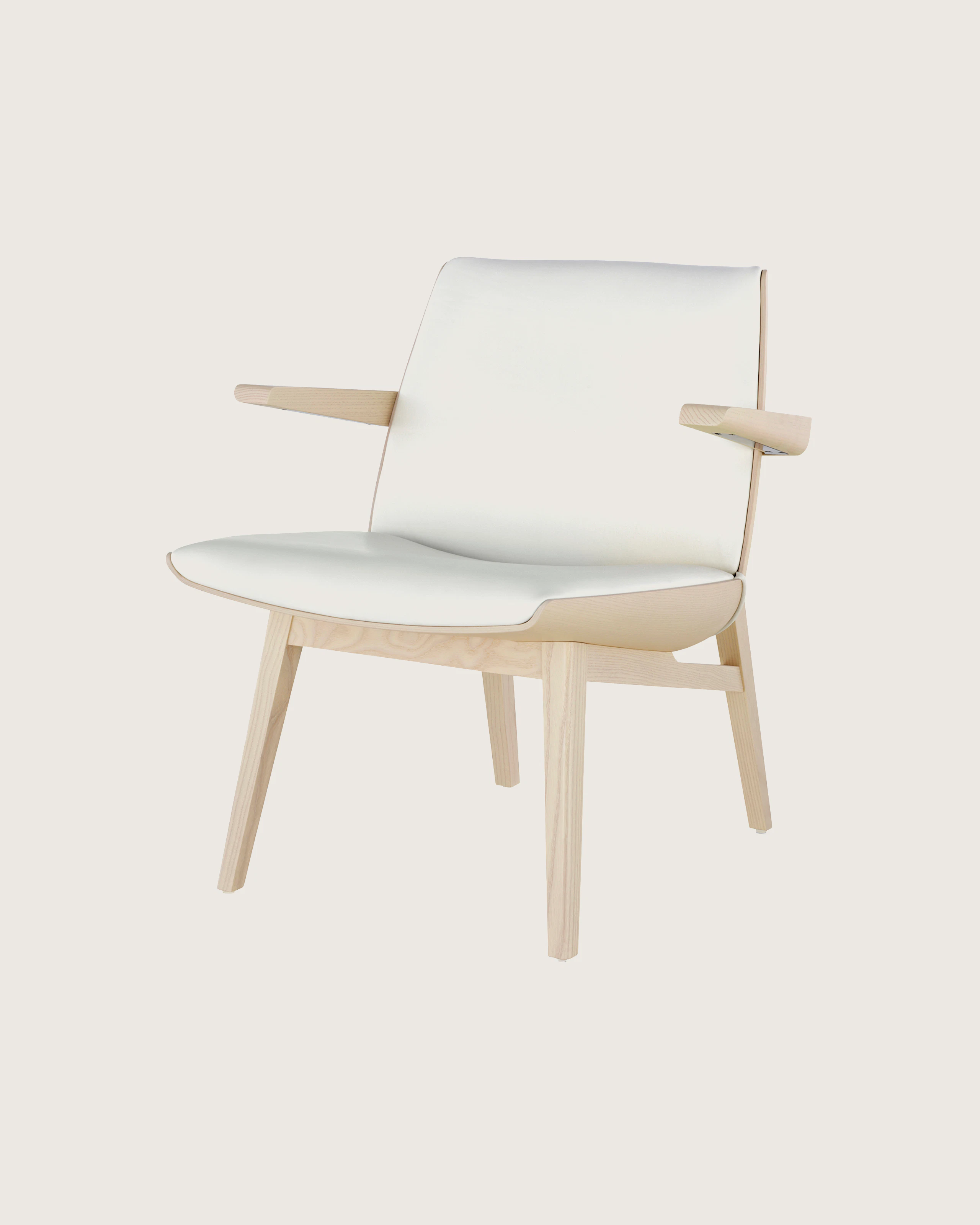 Angled view of a low-back Clamshell Lounge Chair with off-white fabric upholstery and light-ash legs.