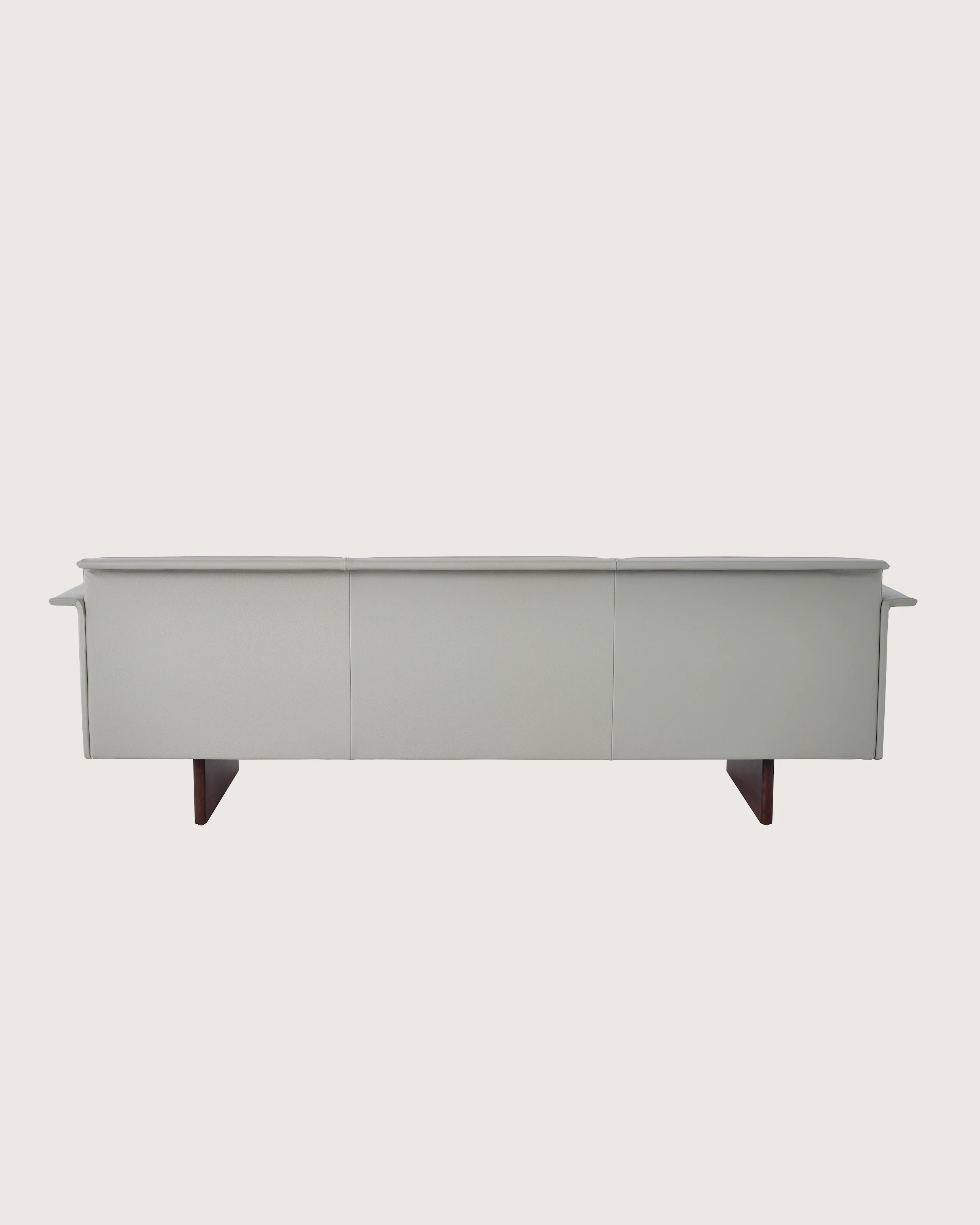 Mantle Three Seater Sofa with Walnut Wood Base in Bristol Leather Ash Gray.