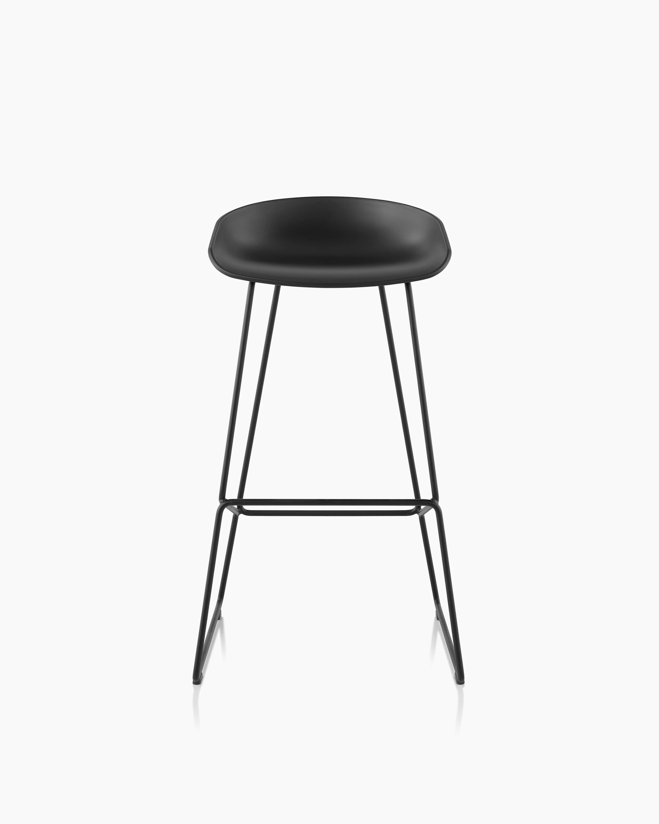 About A Stool in with a low black powder coat and black steel base.