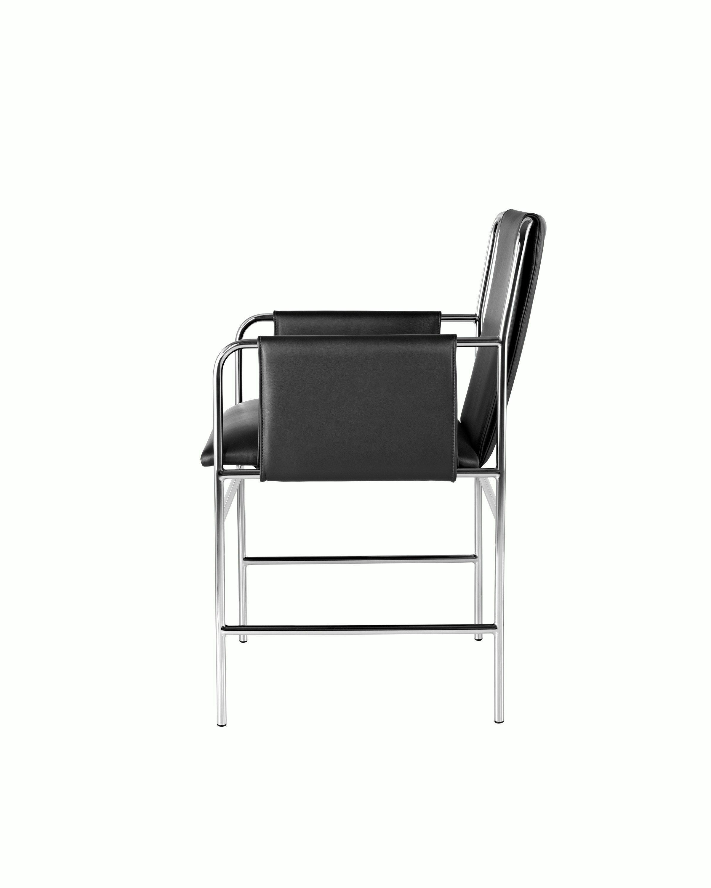 Side view of an Envelope side chair with black leather upholstery and a tubular steel frame.