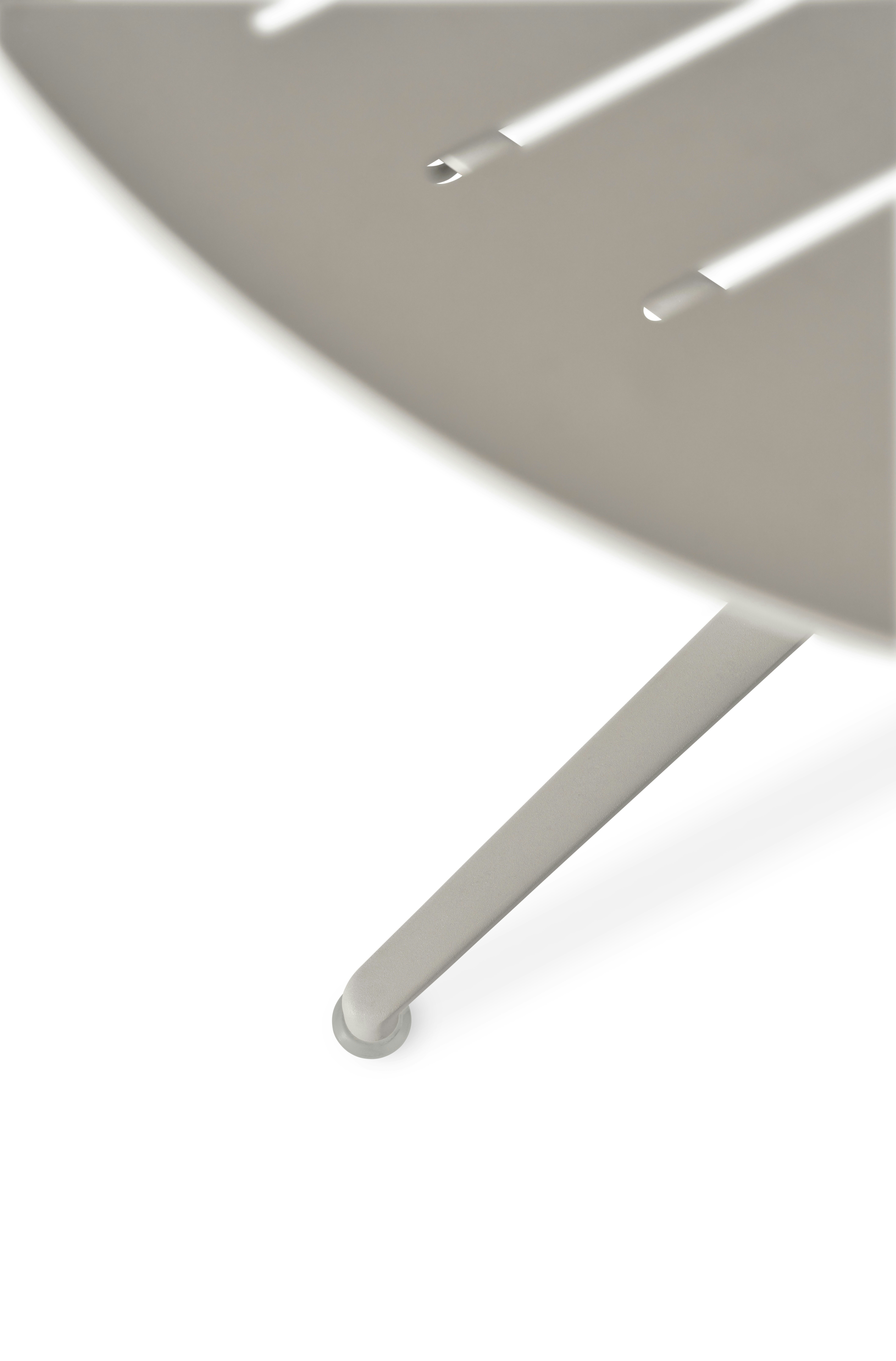A detailed look at the Vipp717 Open-Air Cafe Table.