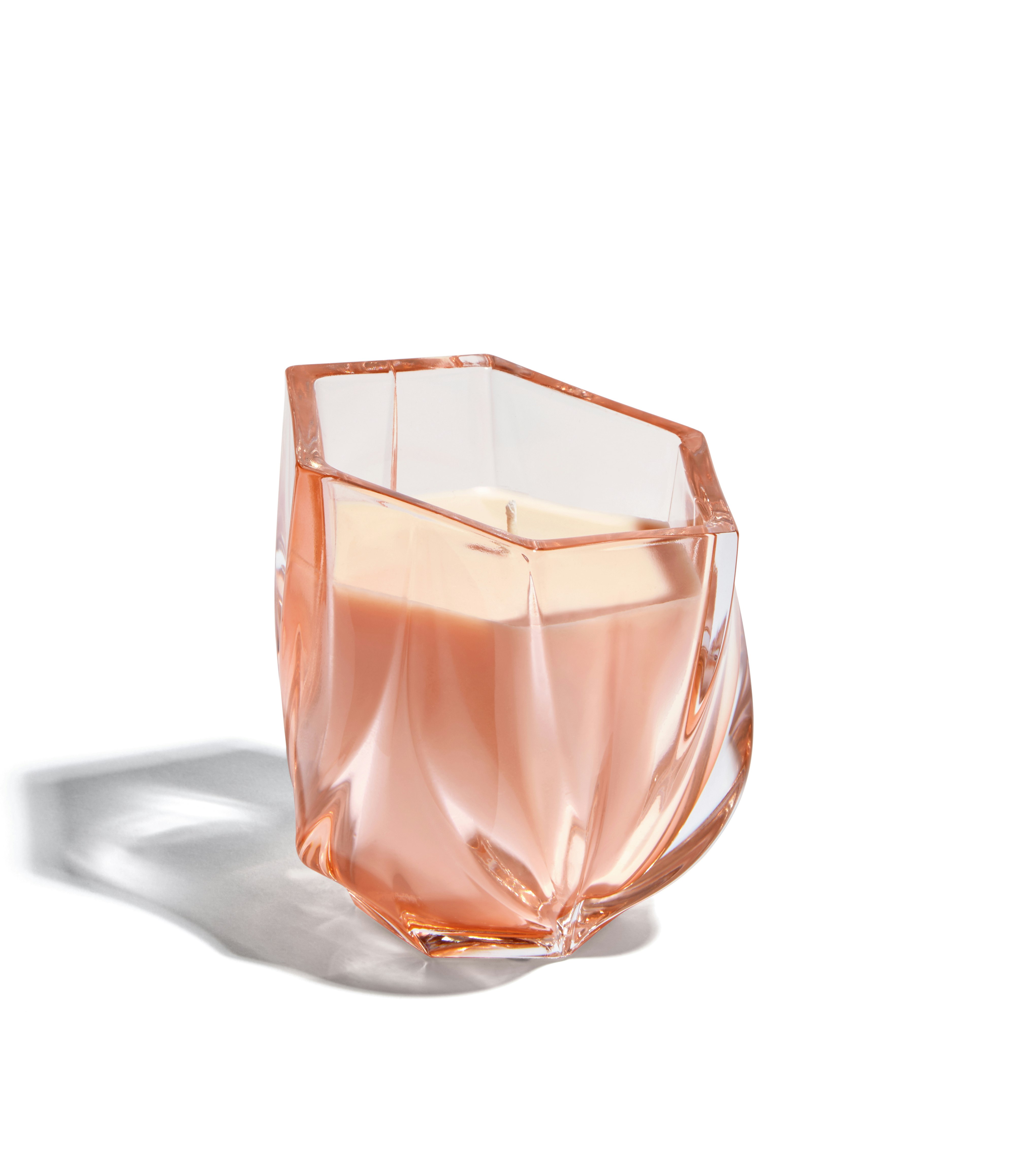 A Shimmer Scented Candle in Rose viewed from an angle.