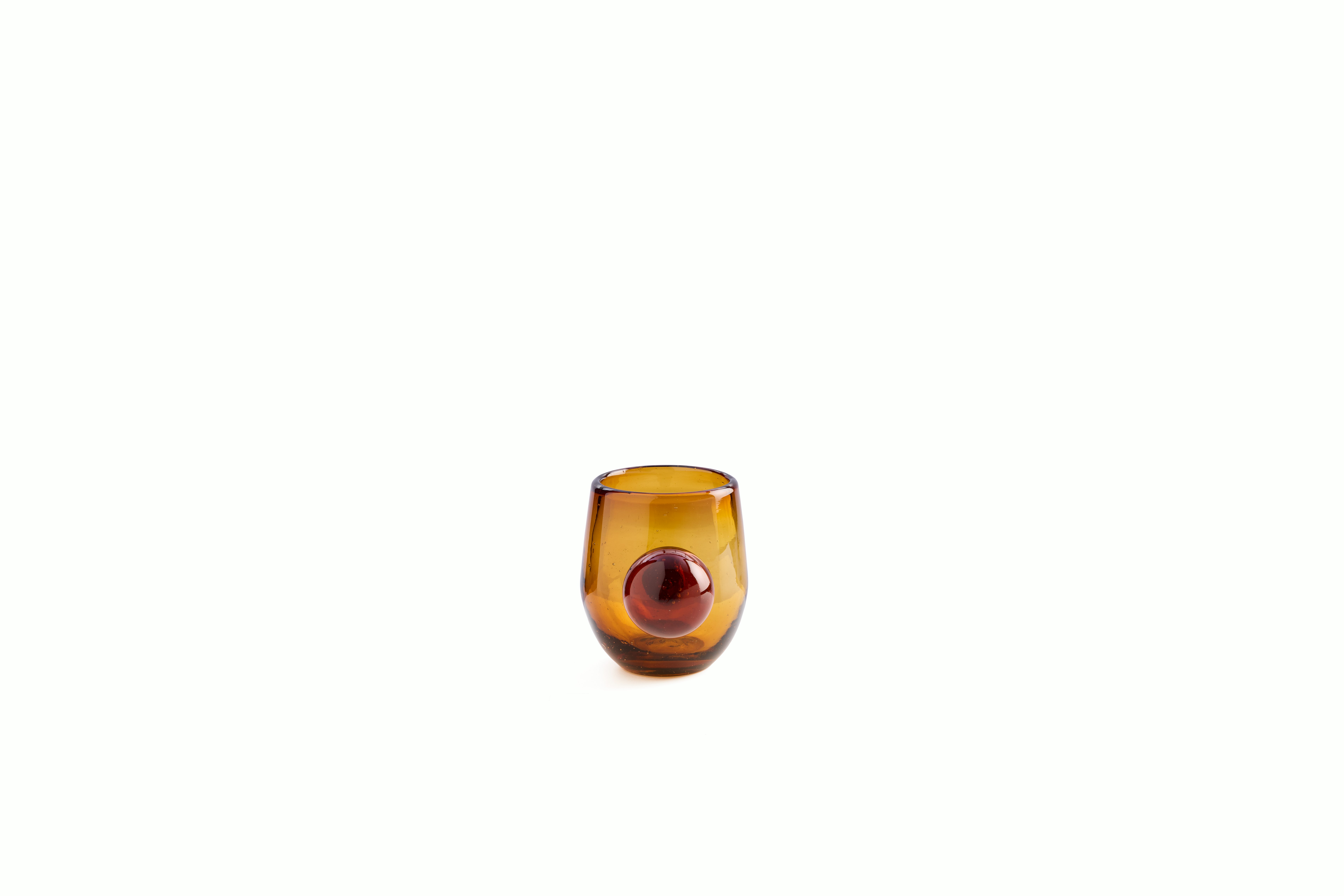 A Roo Glasses, Set of 4 in Amber viewed from the side.