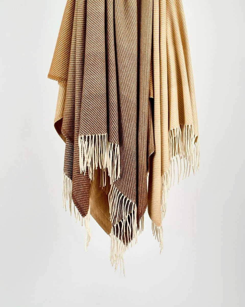 A detailed look at a Cashmere Throw in Ombre Camel.