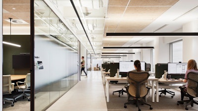 Open plan office with height-adjustable desks and Mirra 2 Chairs.