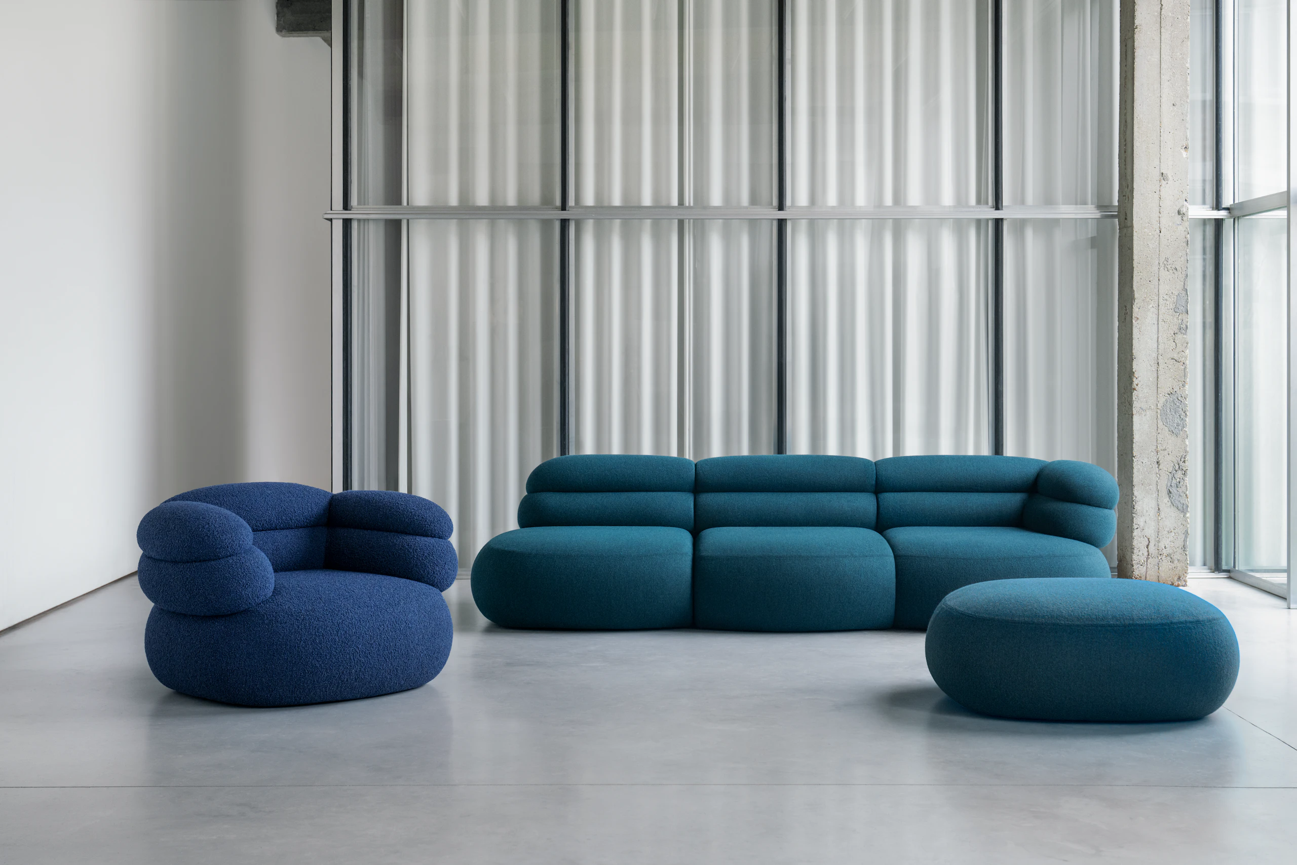 Biboni open end sofa in stellium fabric, Biboni Lounge Chair and Biboni Ottoman.