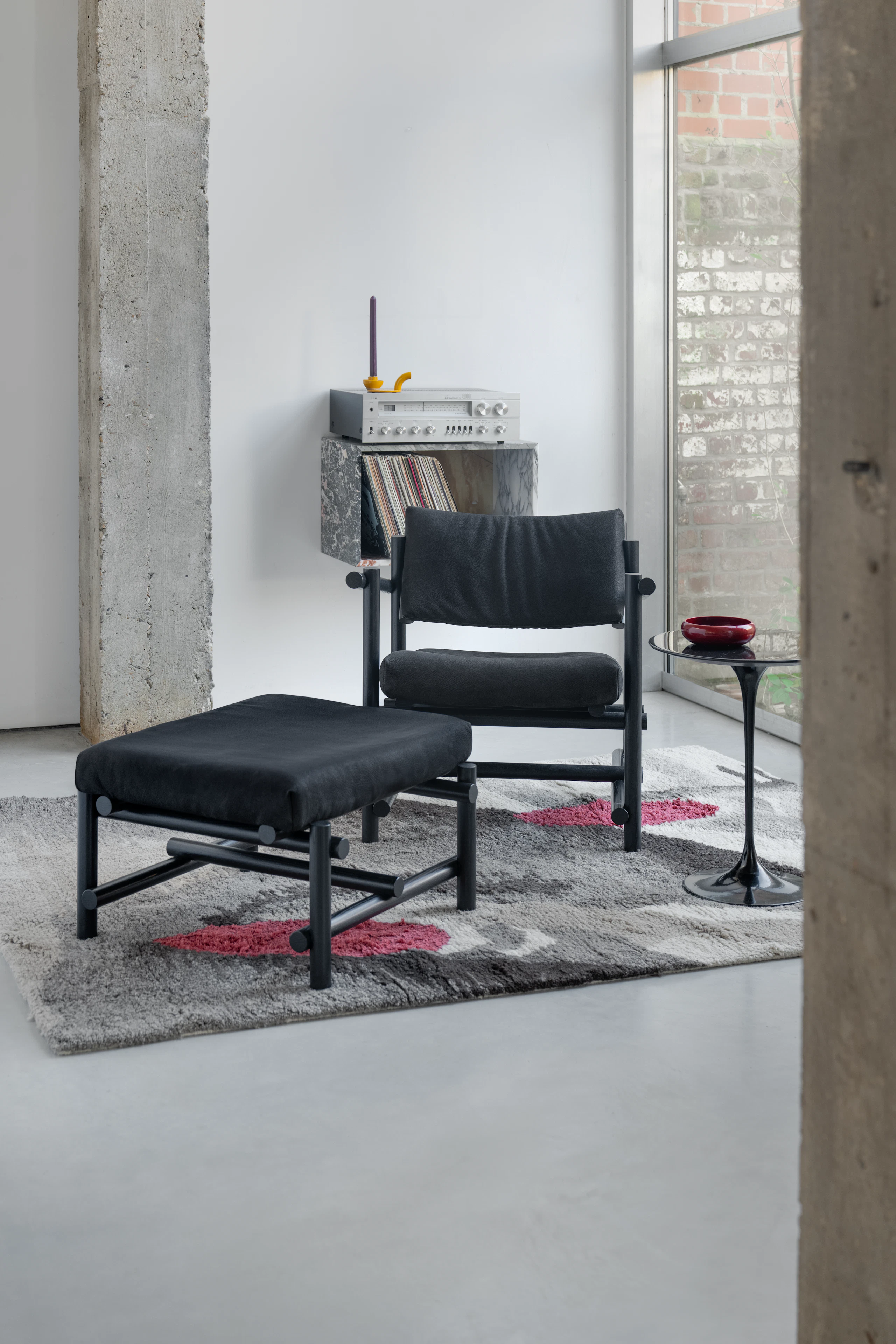 Muecke Lounge Chair and Ottoman in Lava Black with Ebonized Ash frame