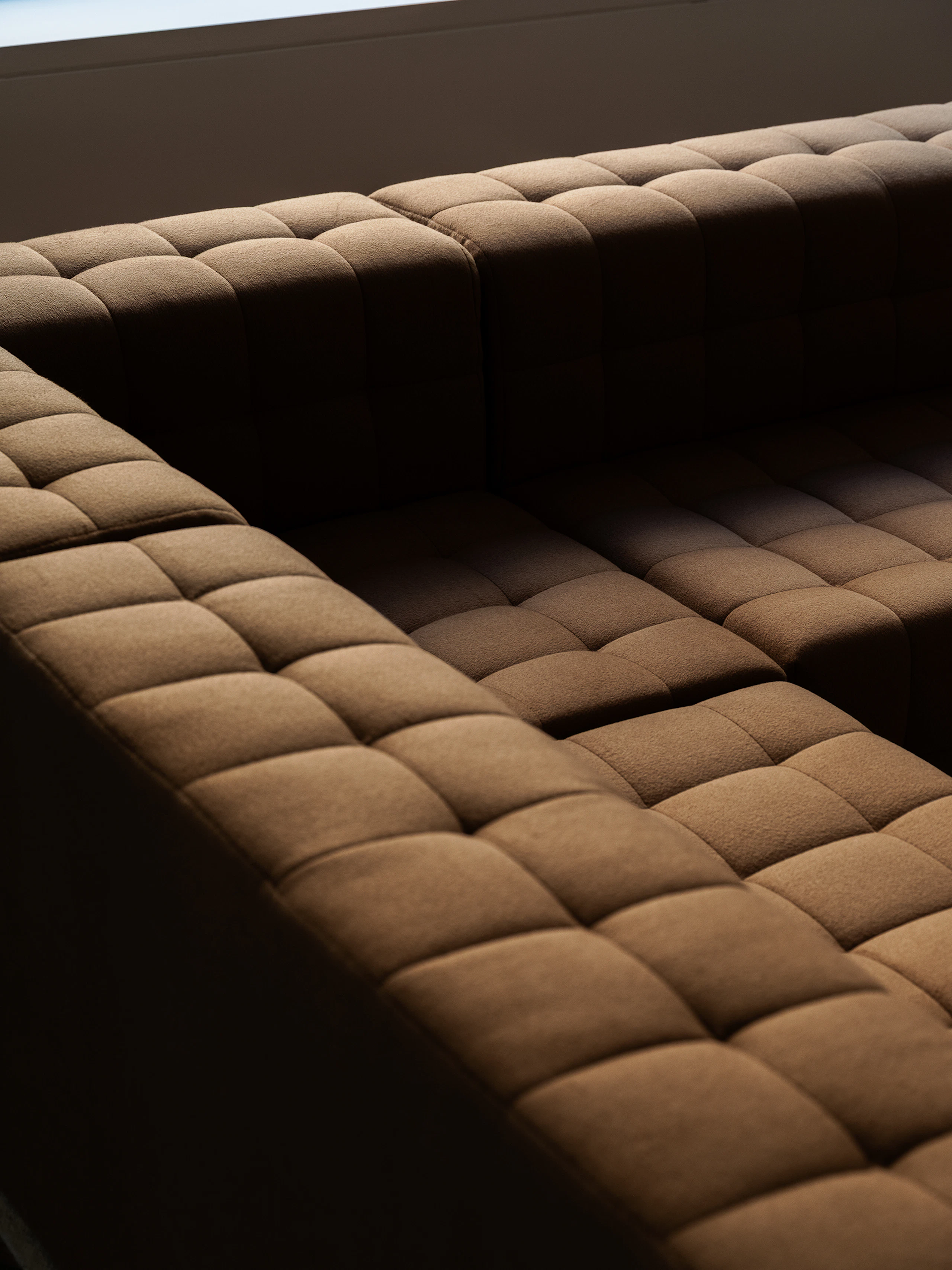 A Rapport Sectional Sofa, upholstered with Brushed Camel textile in Natural, viewed from above at an angle.