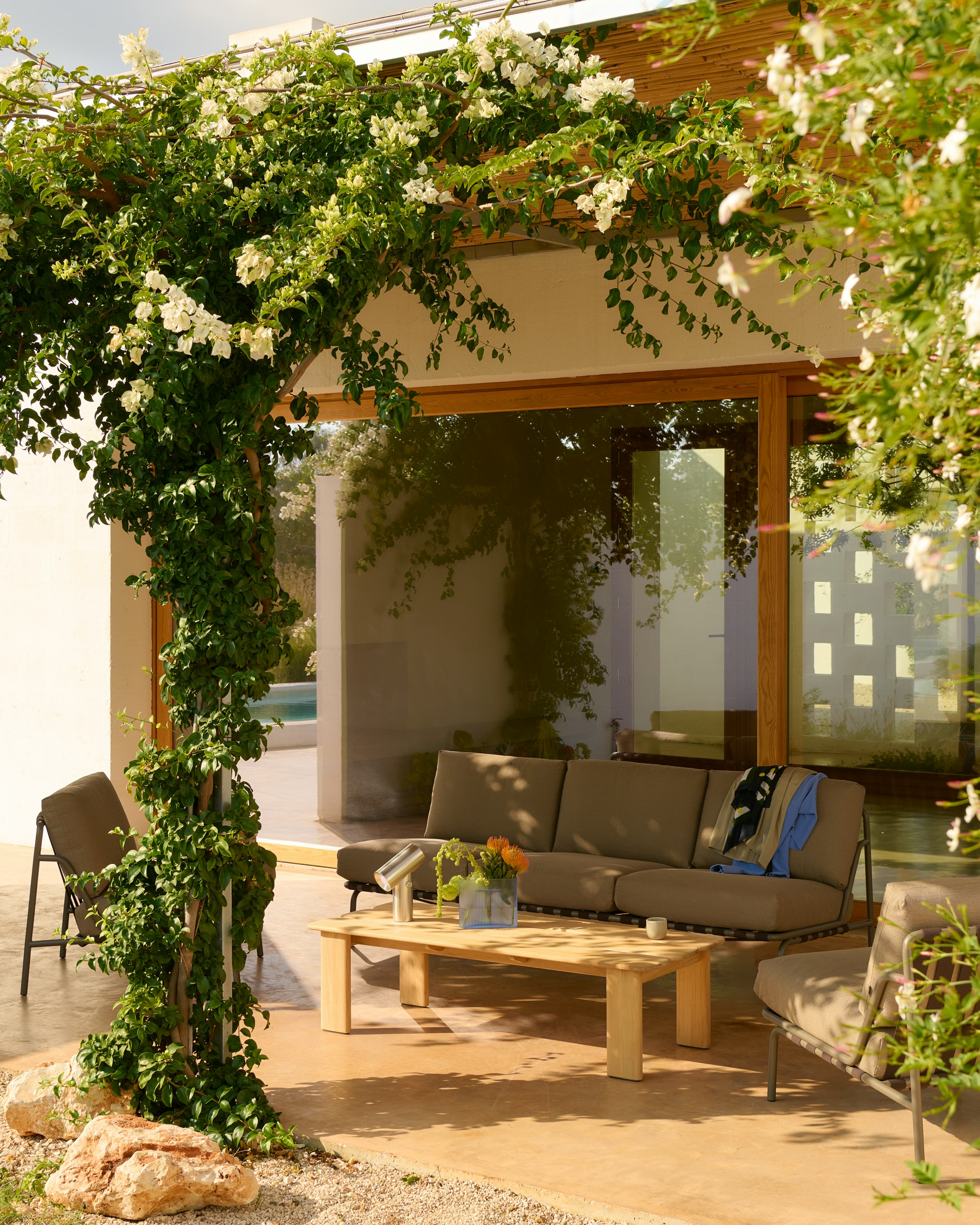 An environmental shot of the Settle Sofa in Light Blue.