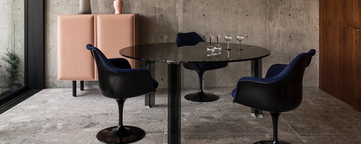 Saarinen Tulip Armchairs, X-T Dining Table, and Tacito Sideboard in a dining room setting