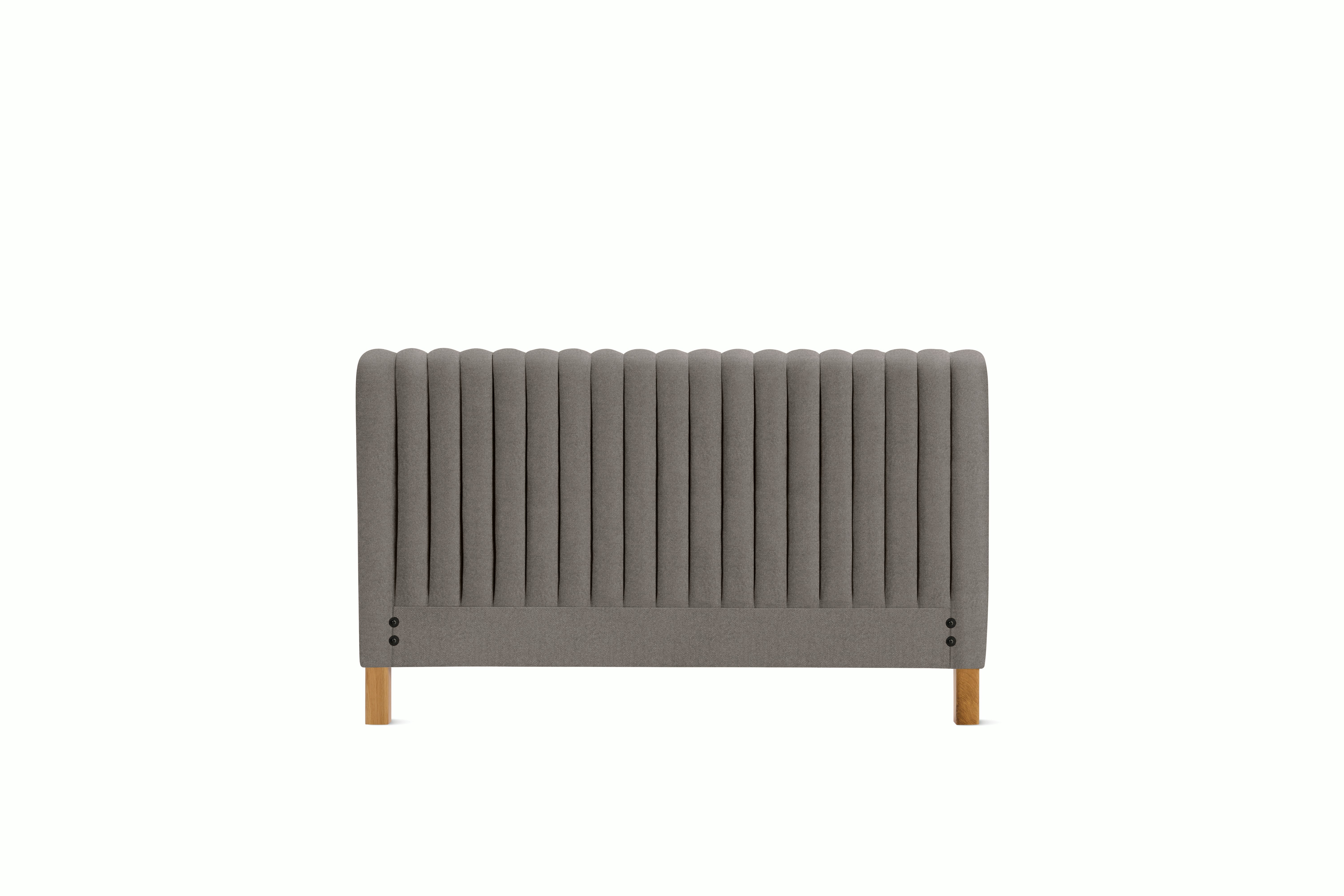 A Charlotte Headboard in Plutonic viewed from an angle.