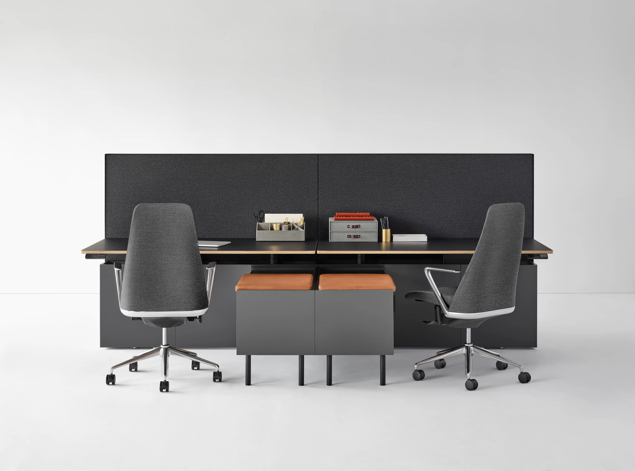 A Geiger One Casegoods bench with accessories, a credenza with a seat pad, and Taper Chairs.