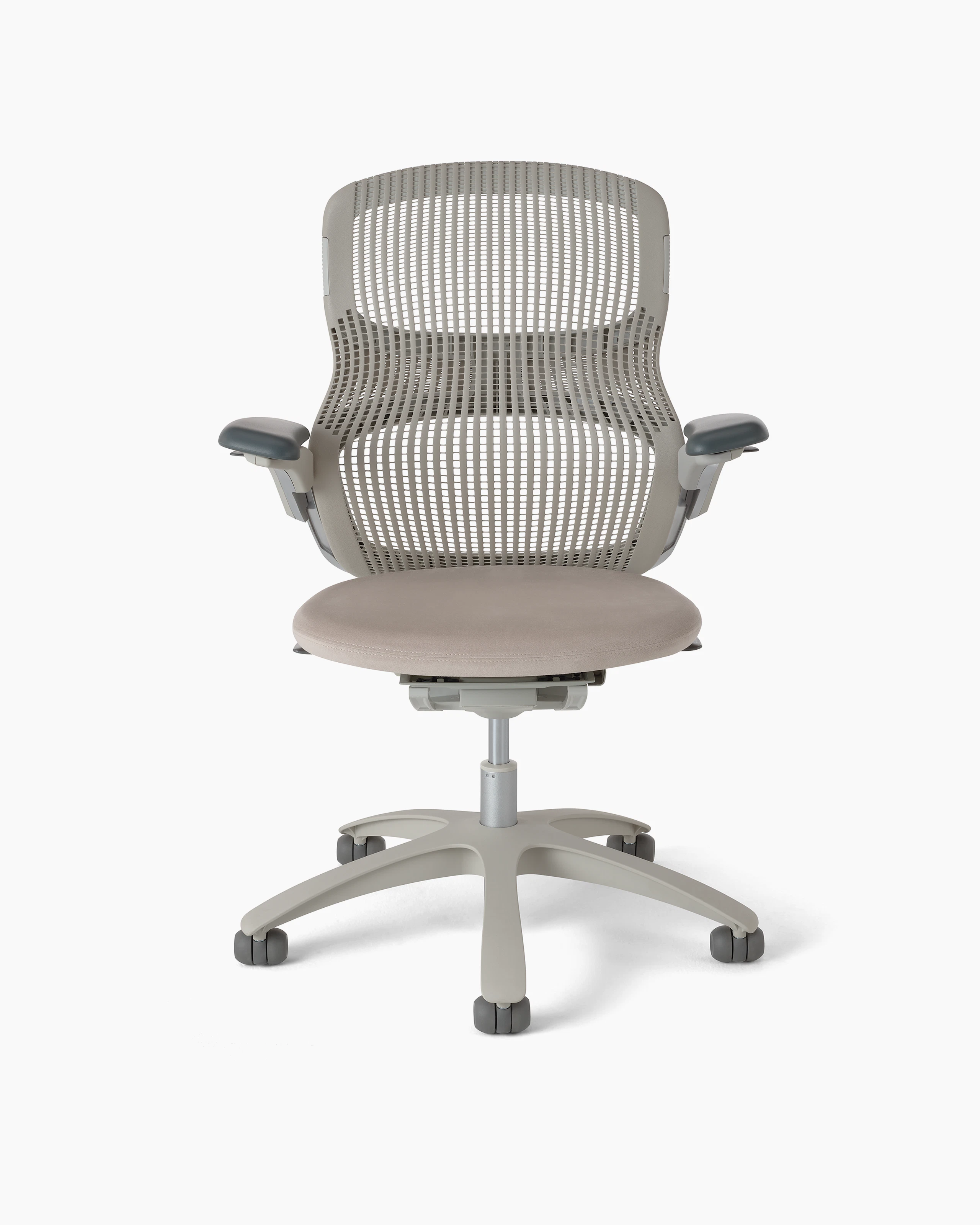 Generation Chair with high performance arms with a light finish, desert back (or tan), plastic base, standard cylinder, no lumbar, and hard casters. The ultra seat foam is upholstered with the Ultrasuede textile in the color Pebble (light tan). White background.