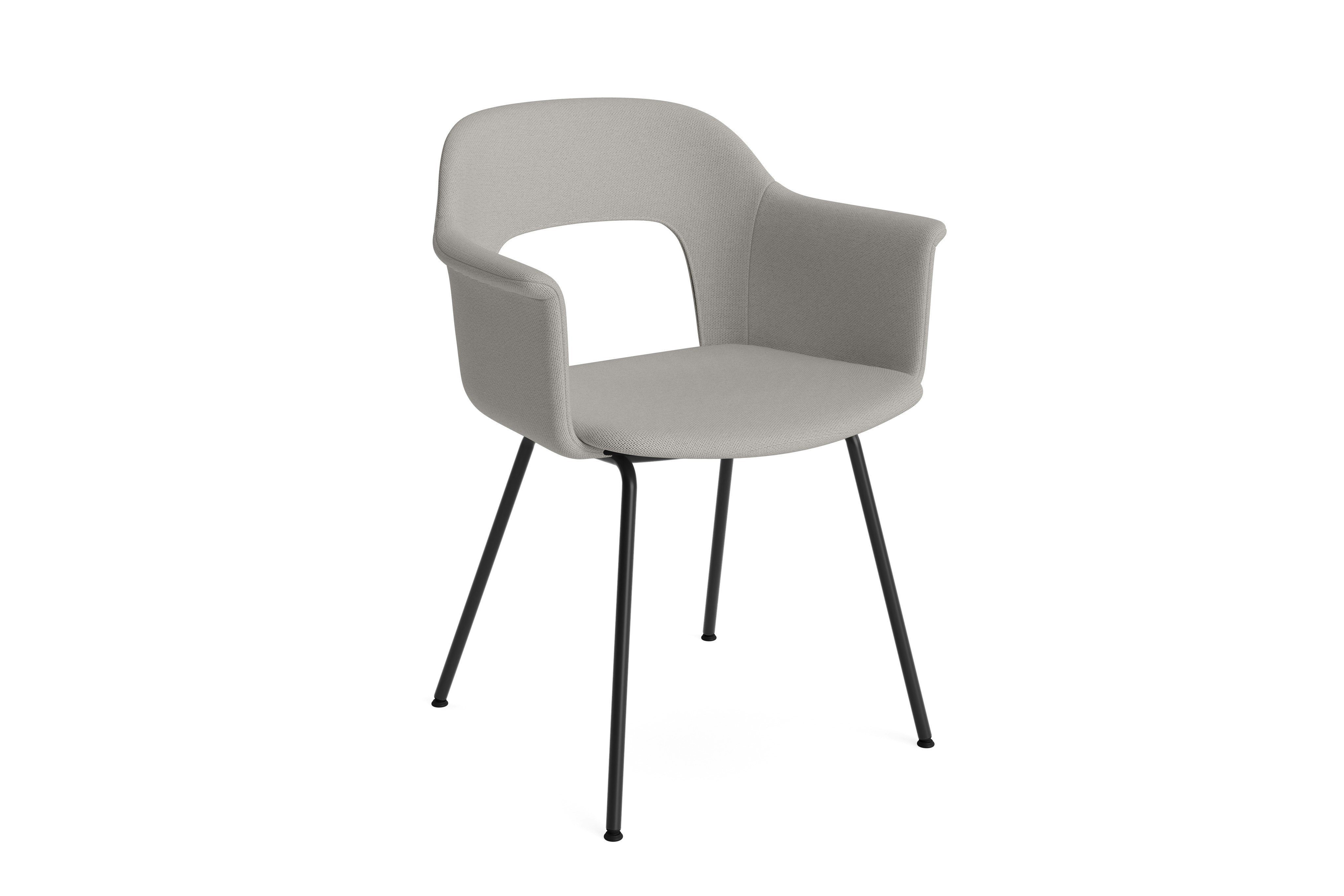 Layout Armchair 214 fully upholstered in taupe on black tube base, angled view on white background.