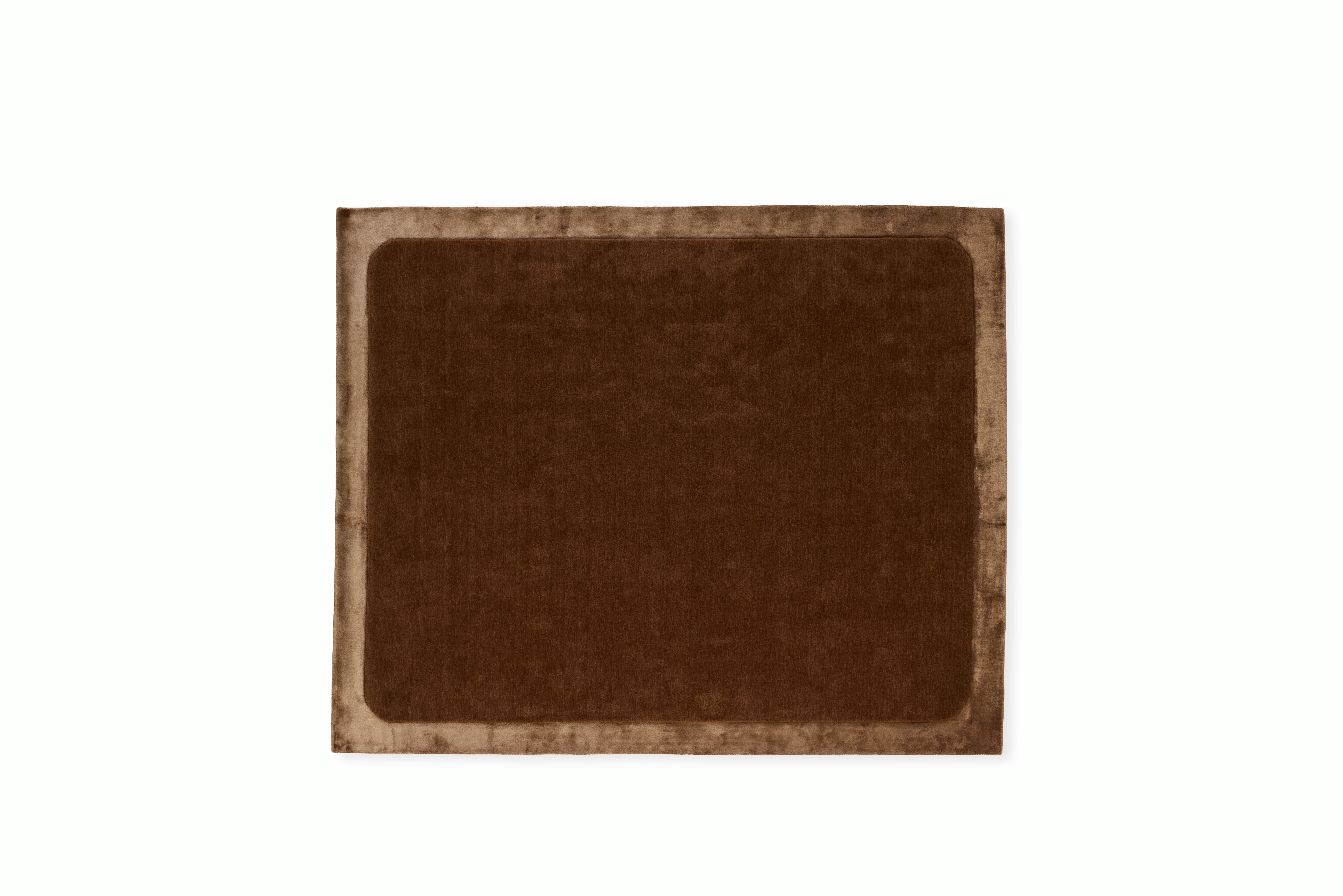 A Radius Inverse Rug in Cocoa viewed from the front.