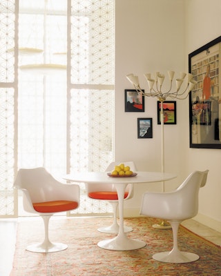 Saarinen Tulip Dining Table and Saarinen Tulip Chairs with Orange seat pads