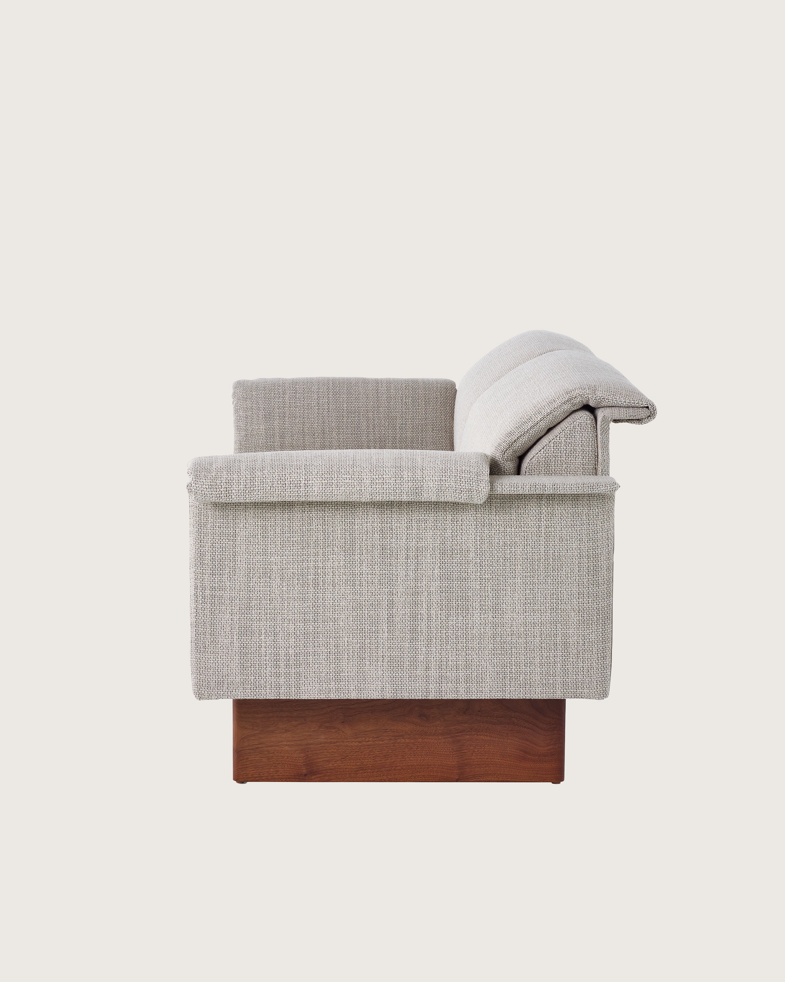 Mantle Two Seater Sofa in Capri Stone with Walnut Wood Base, side view.