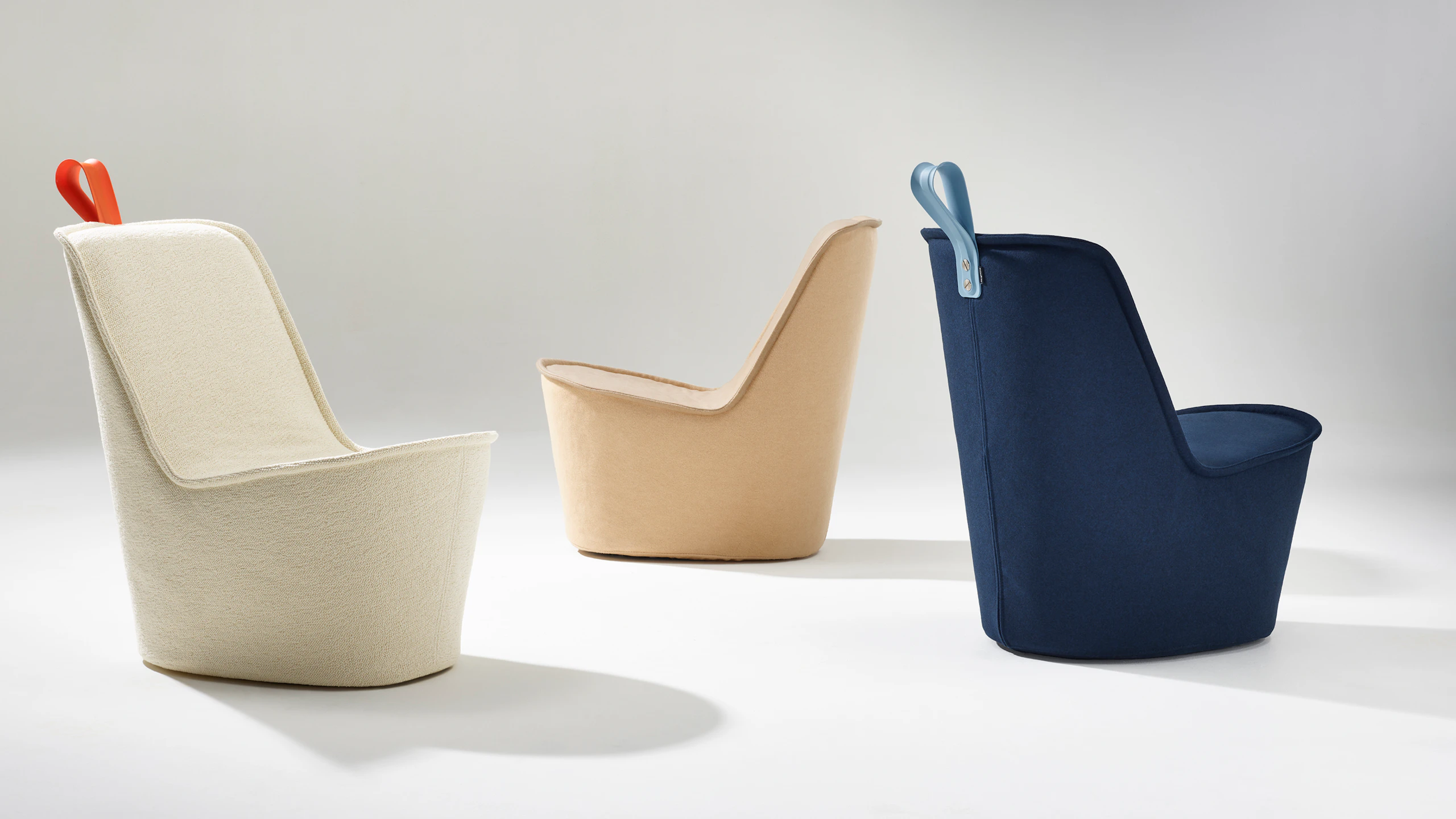 Three NaughtOne Pippin Chairs in Maharam textiles Hearth Wedding, Brushed Camel Albino, and Gemma Multi Tanzanite.