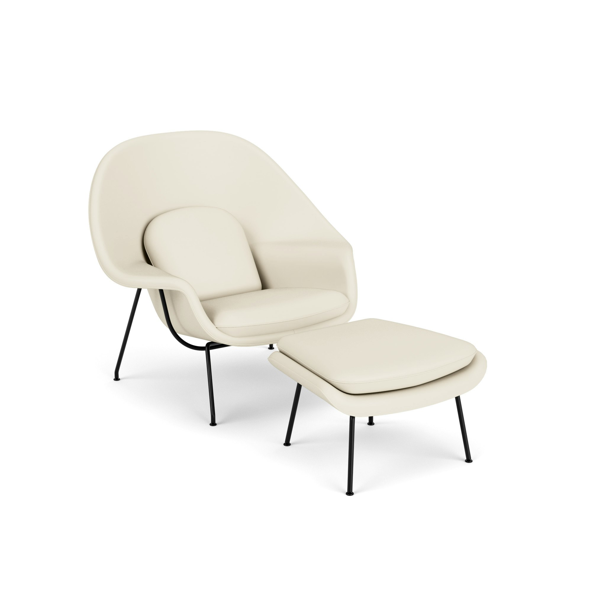 An ivory Womb Chair & Ottoman viewed from an angle