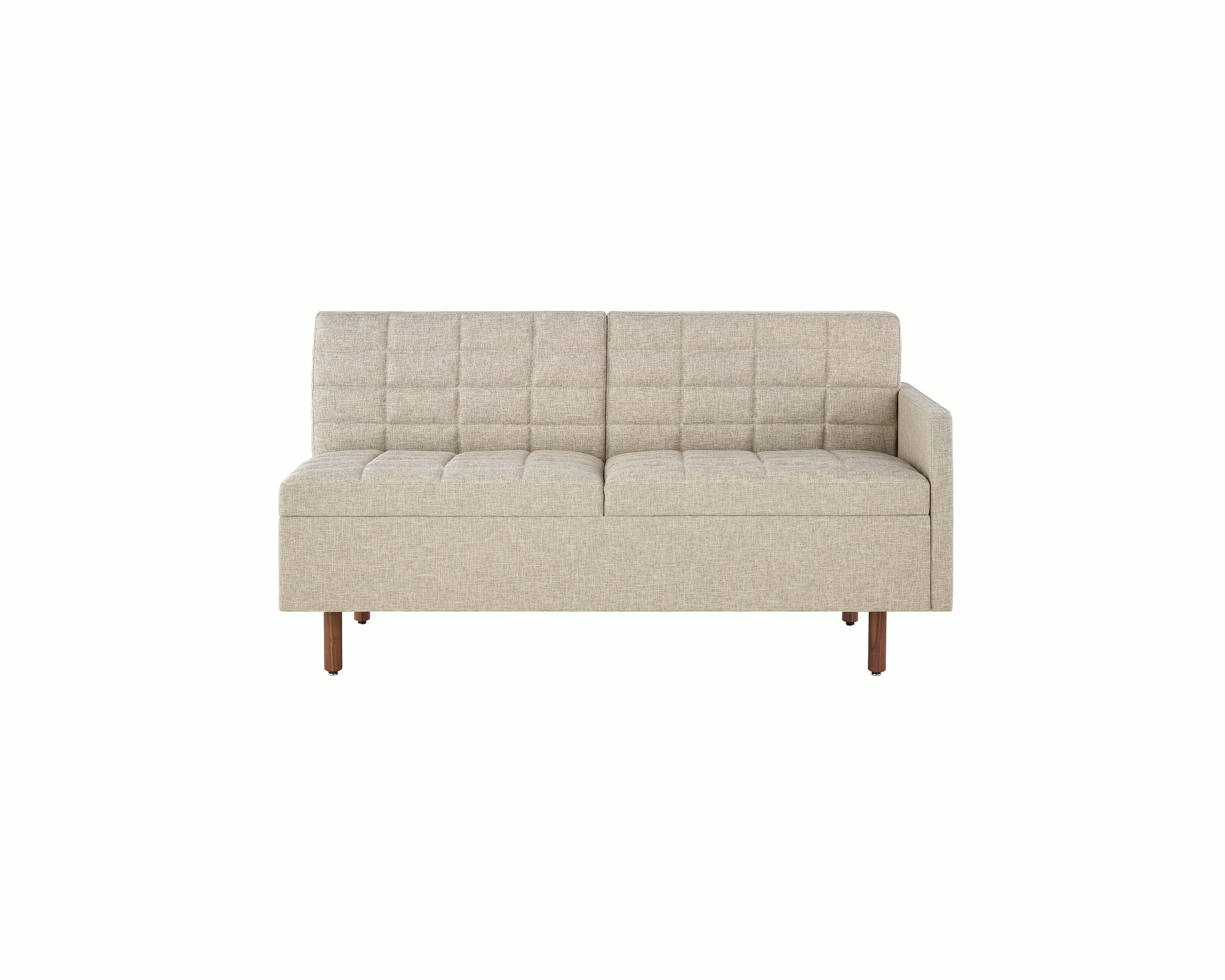 A quilted Tuxedo Classic connecting settee upholstered in bone-colored fabric, viewed from the front.