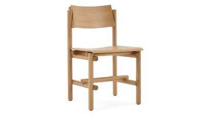 A front three quarter view of a Muecke Wood Chair by Knoll