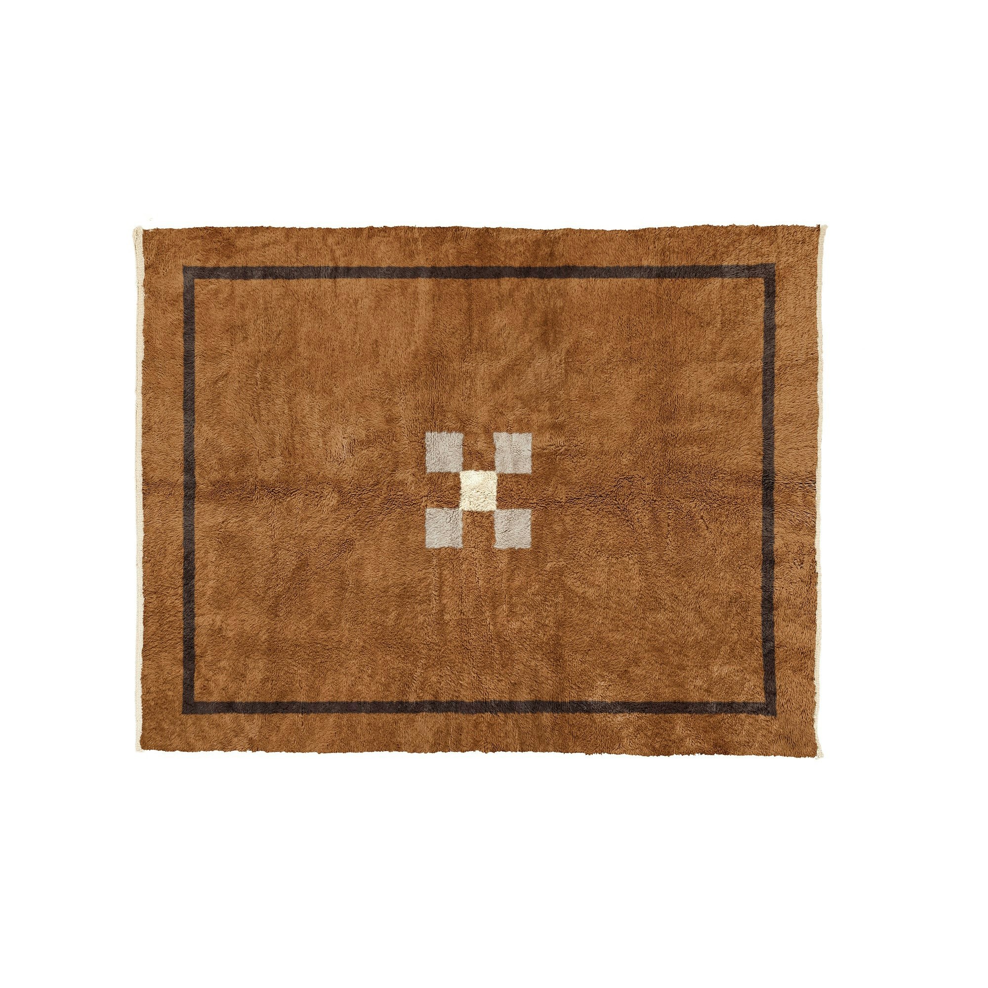 A Repit Shag Rug in Brown viewed from the front.