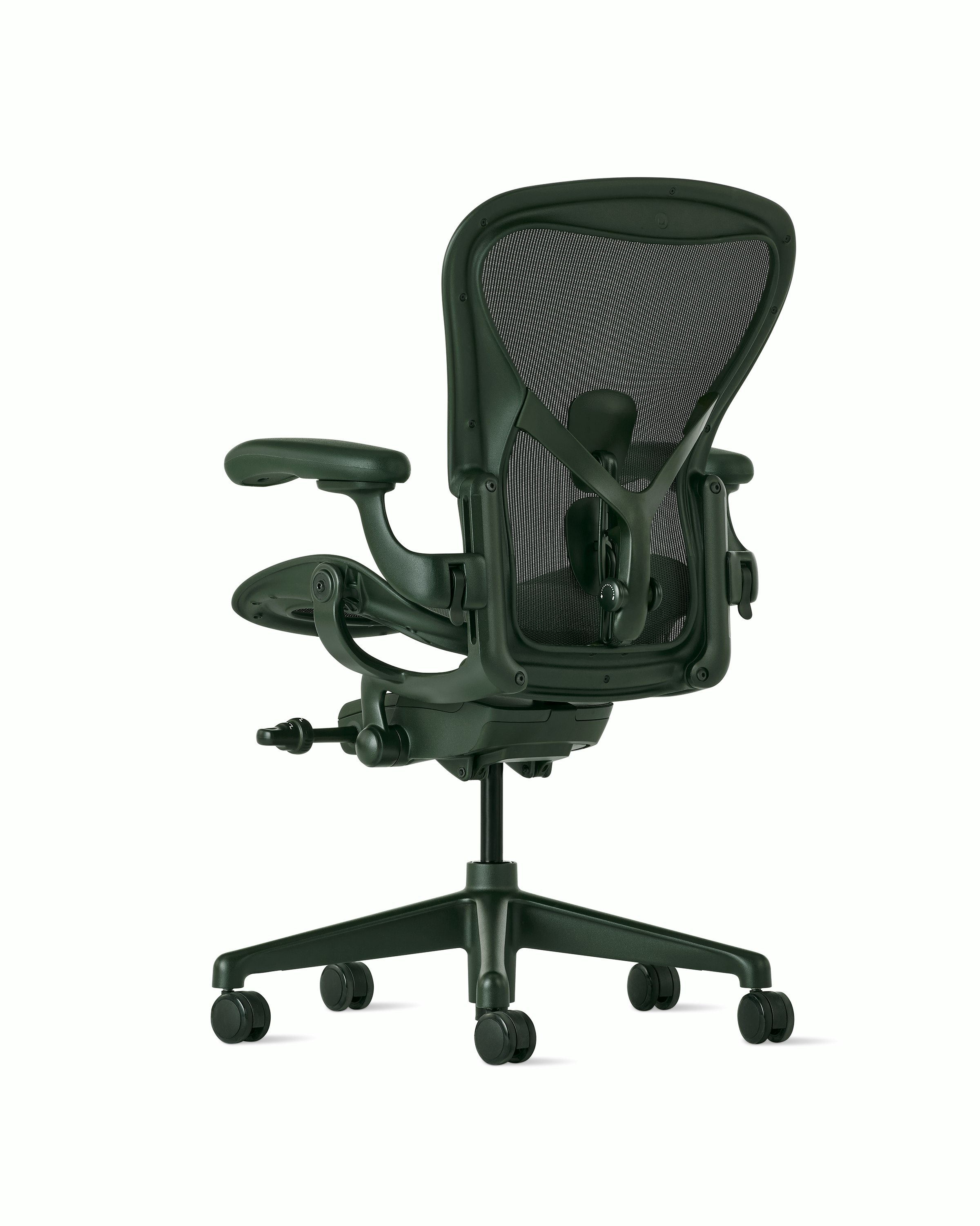 Rear angle view of an Aeron chair in dark green with PostureFit SL.