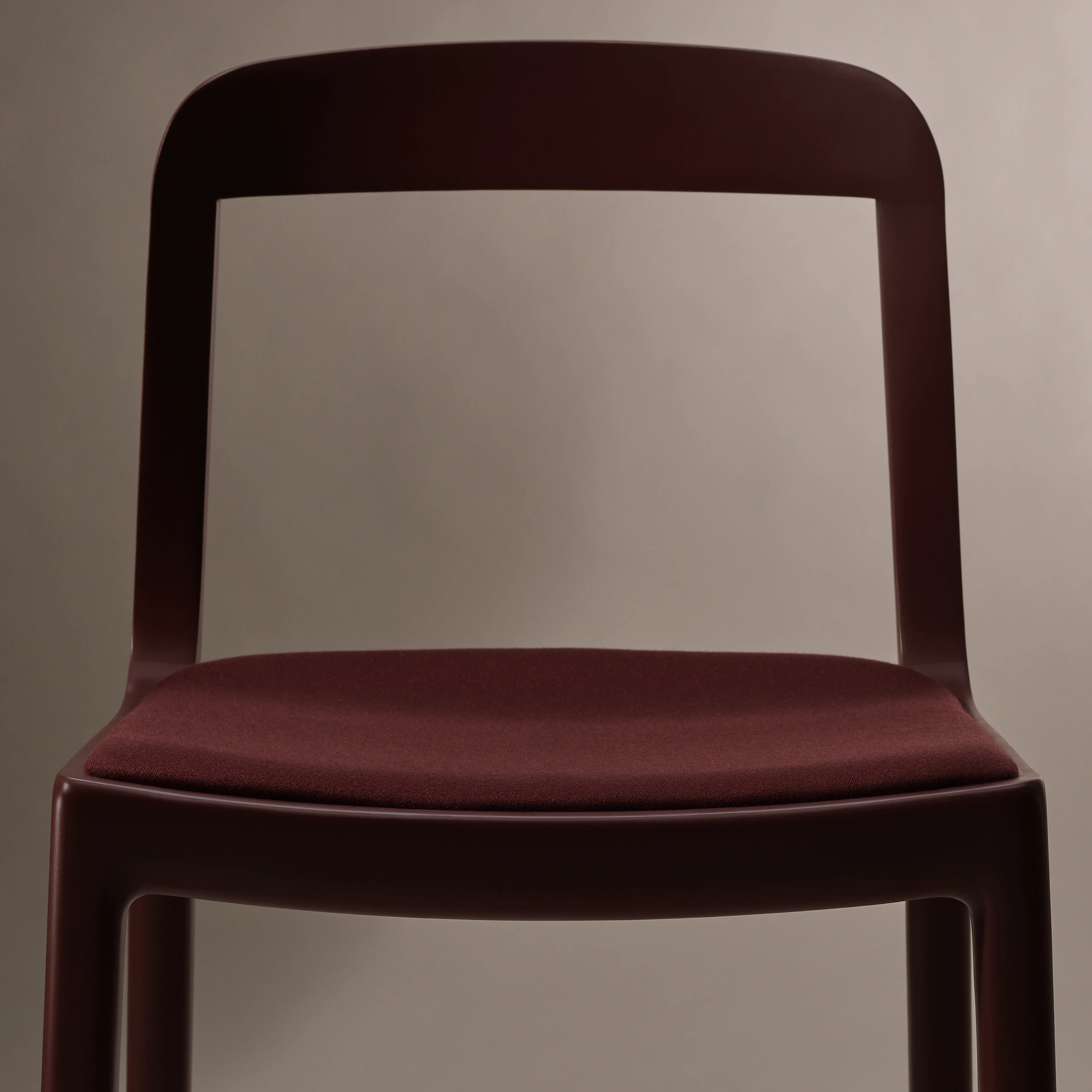 Lijn Side Chair by Carole Baijings for Geiger in Red Clay frame upholstered with Maharam Valor in Saloon, detail shot on a neutral background.