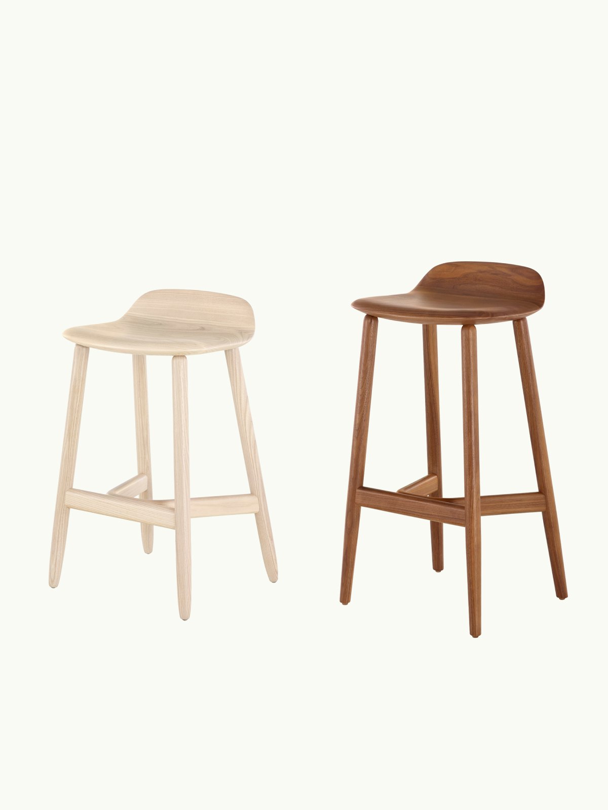 Two Crosshatch Stools designed by EOOS, one counter-height in Oak, one bar-height in walnut, both shown at an angle on a white sweep.