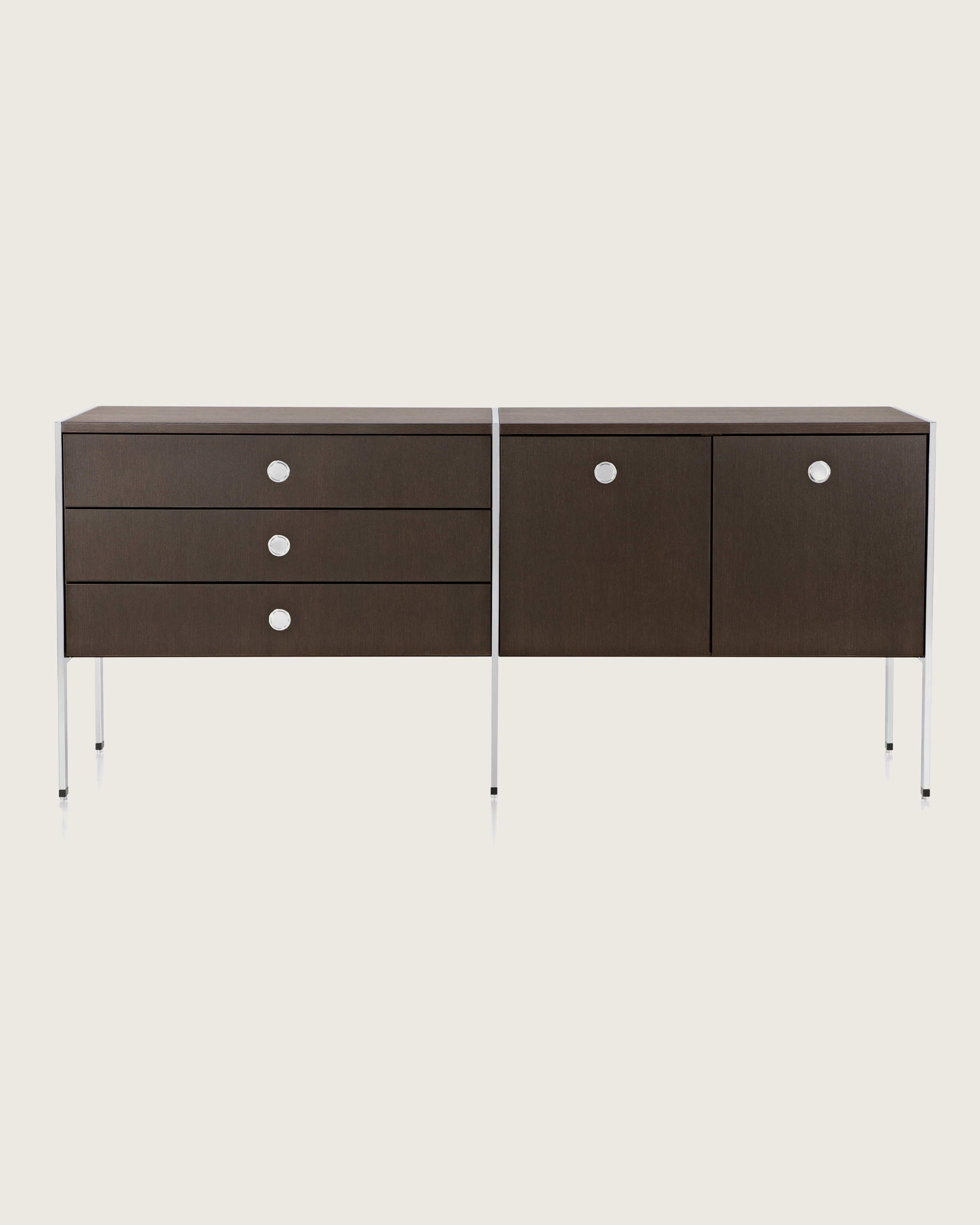 A two-unit H Frame Storage credenza with a dark wood finish and modules for box drawers and enclosed cabinets.
