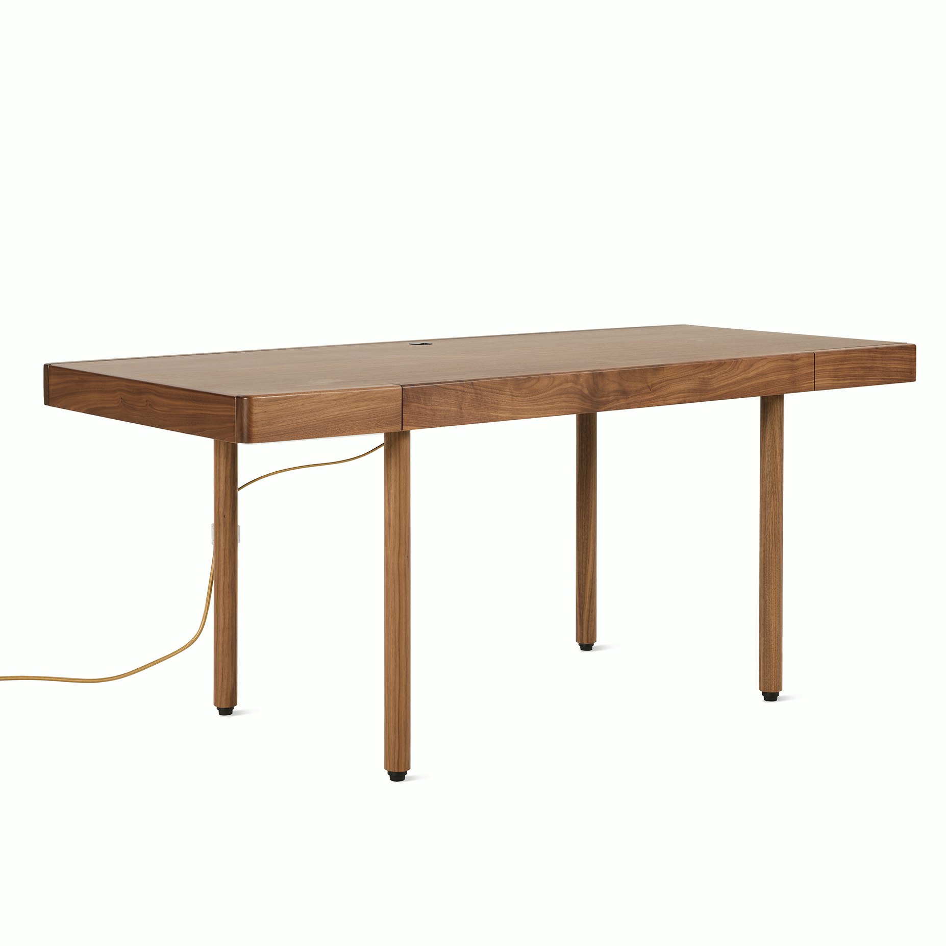 A New Canaan Wood Sit-to-Stand Desk in Walnut viewed from an angle.