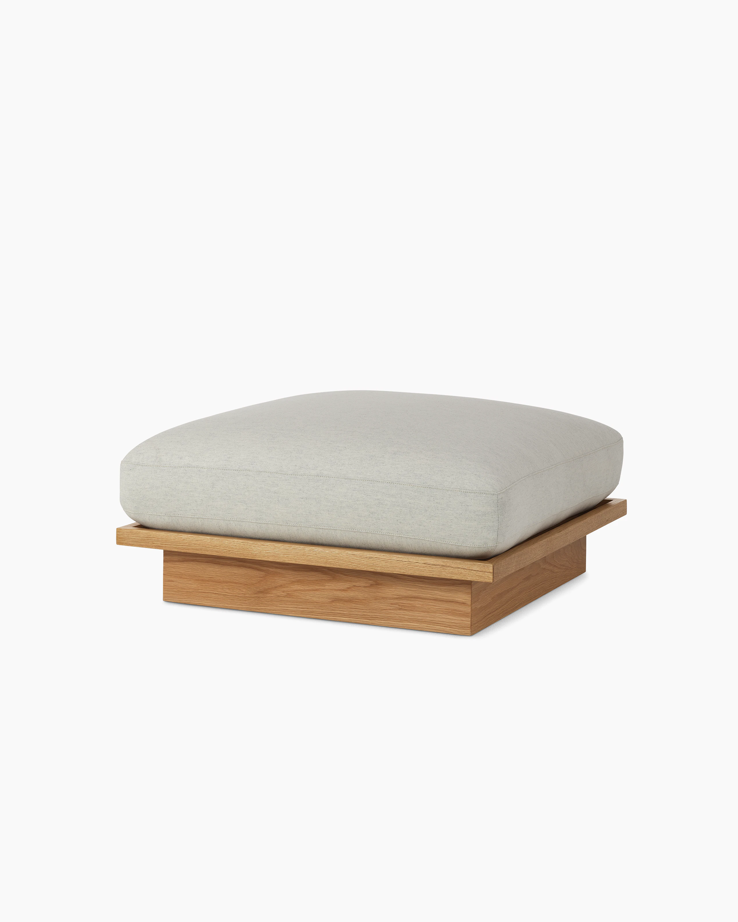 Pawson Drift Ottoman with white upholstery and white oak base, viewed from an angle.