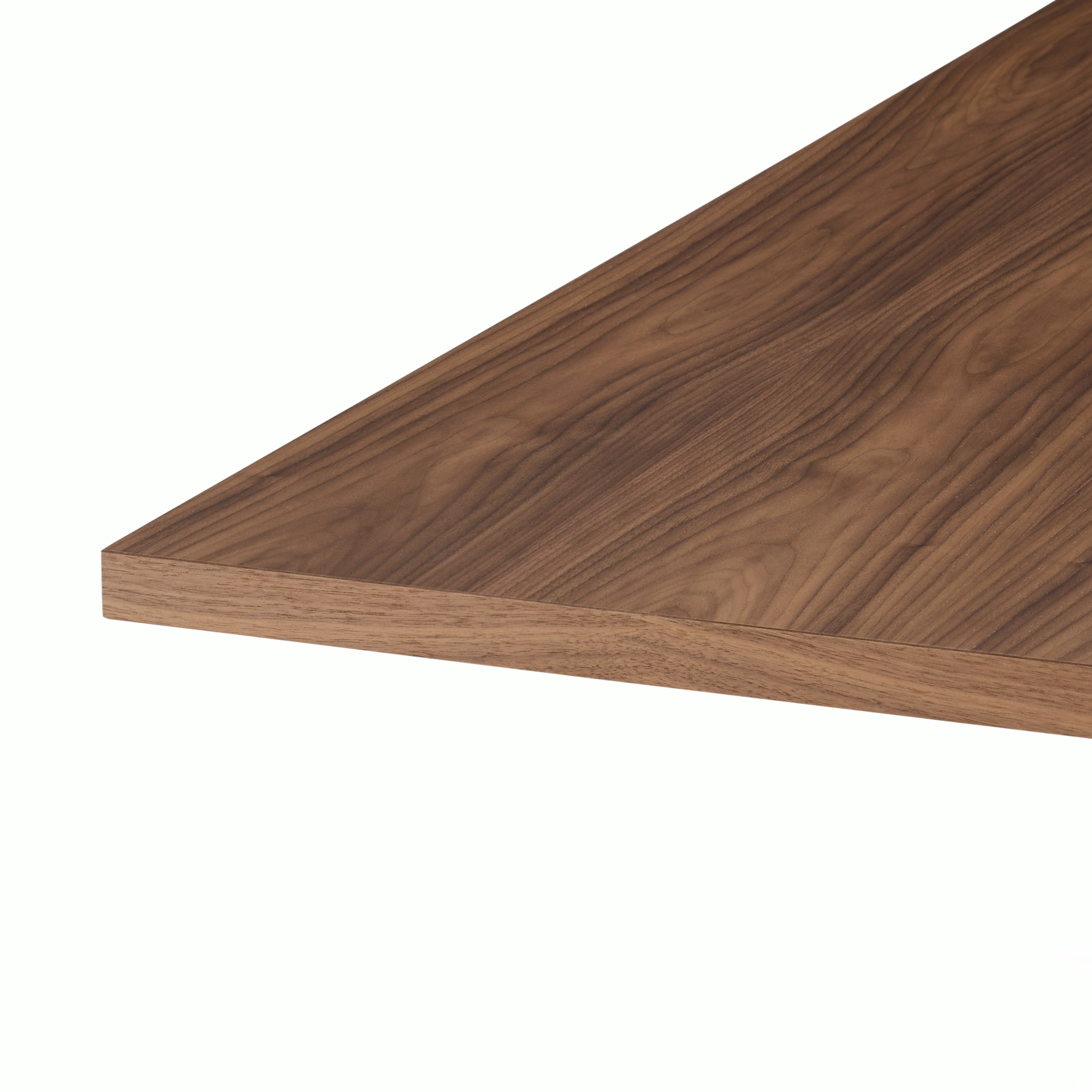 MP Table designed by Amir Paknya for Geiger in Natural Flat Cut Walnut shown on a white sweep, angled detail view of table edge.
