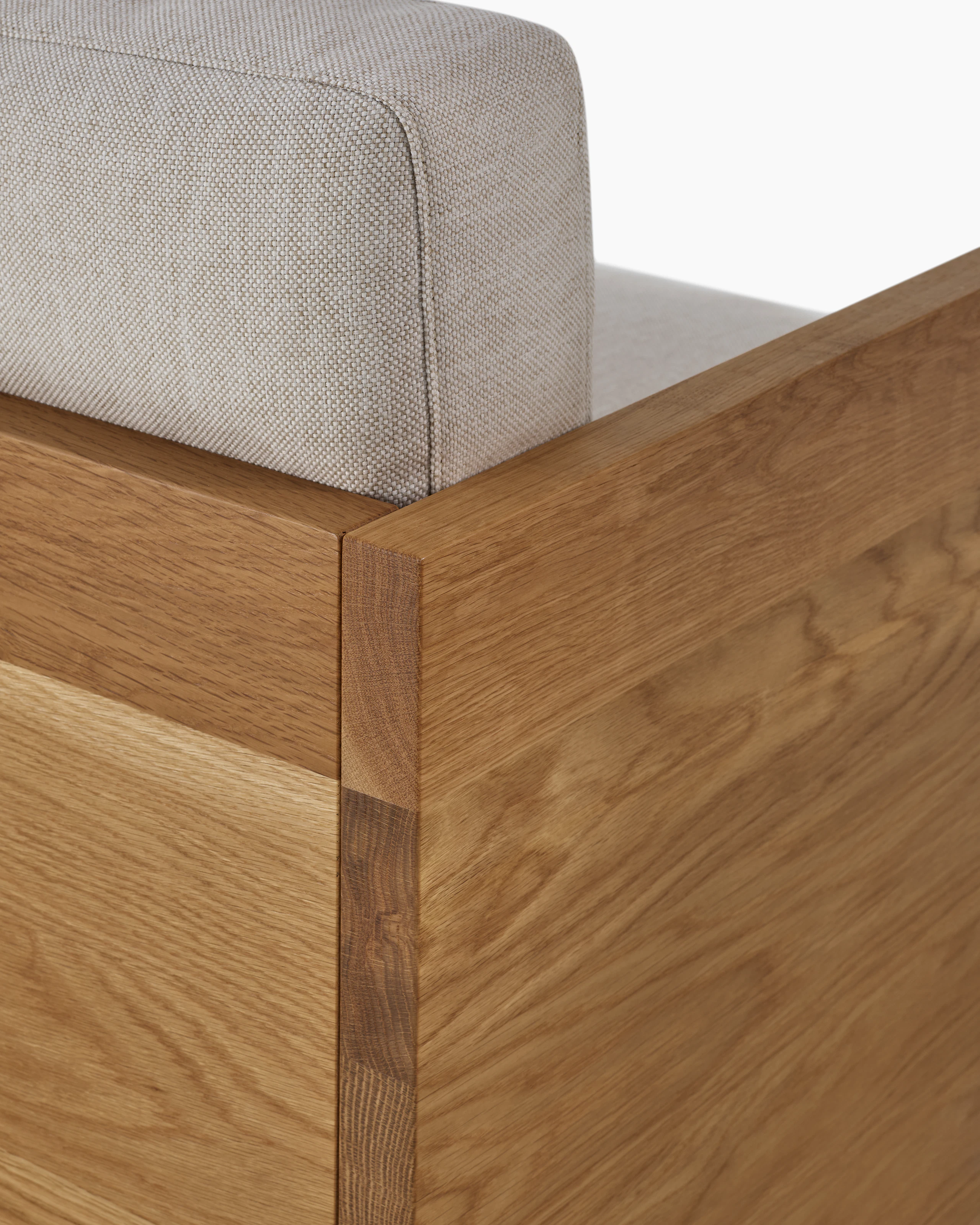 Detail of back of the Pawson Drift Sofa in oak and grey cushions (Mode Clavicle