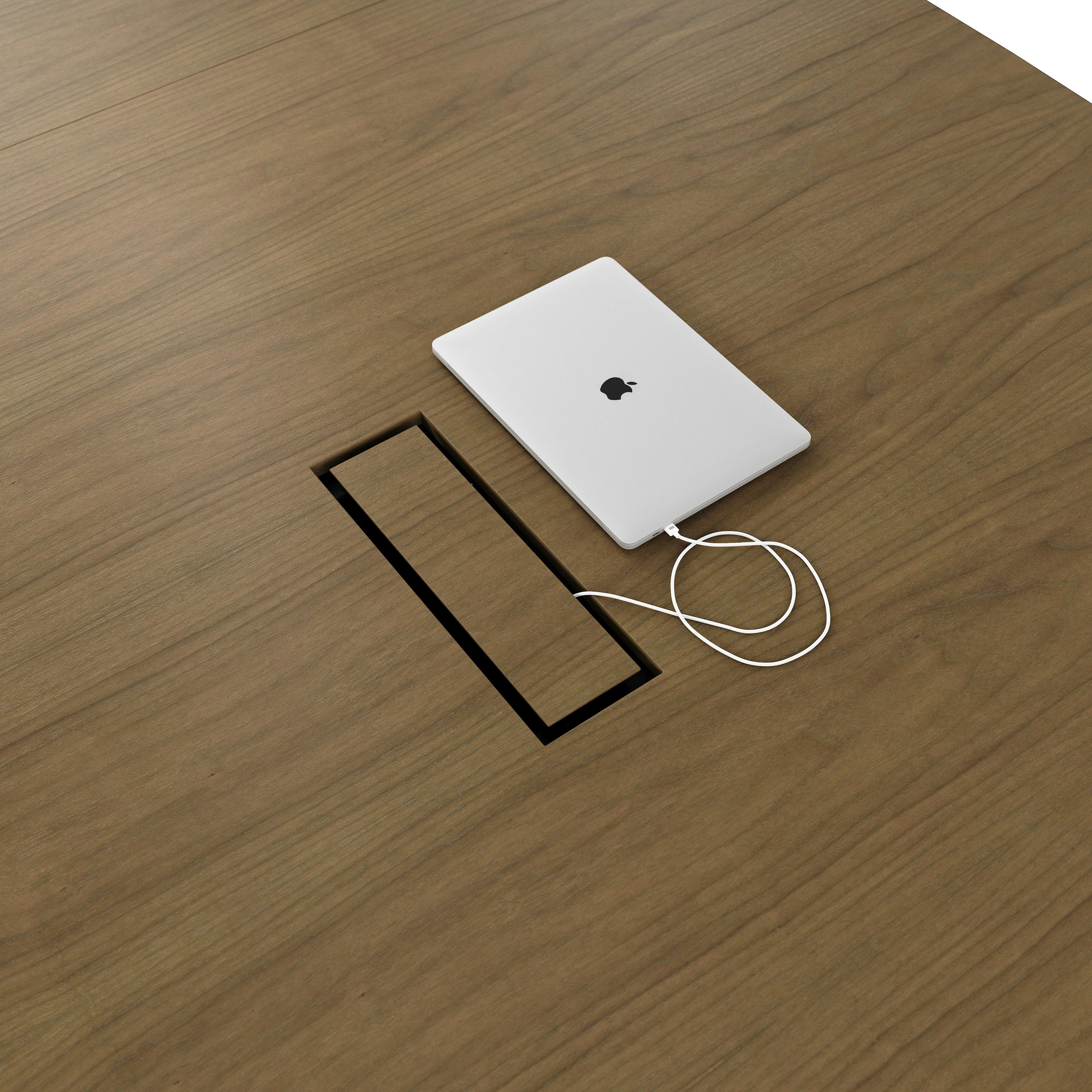 Detail shot of tabletop power access on a Highline Fifty Conference Table in Natural Flat Cut Walnut.