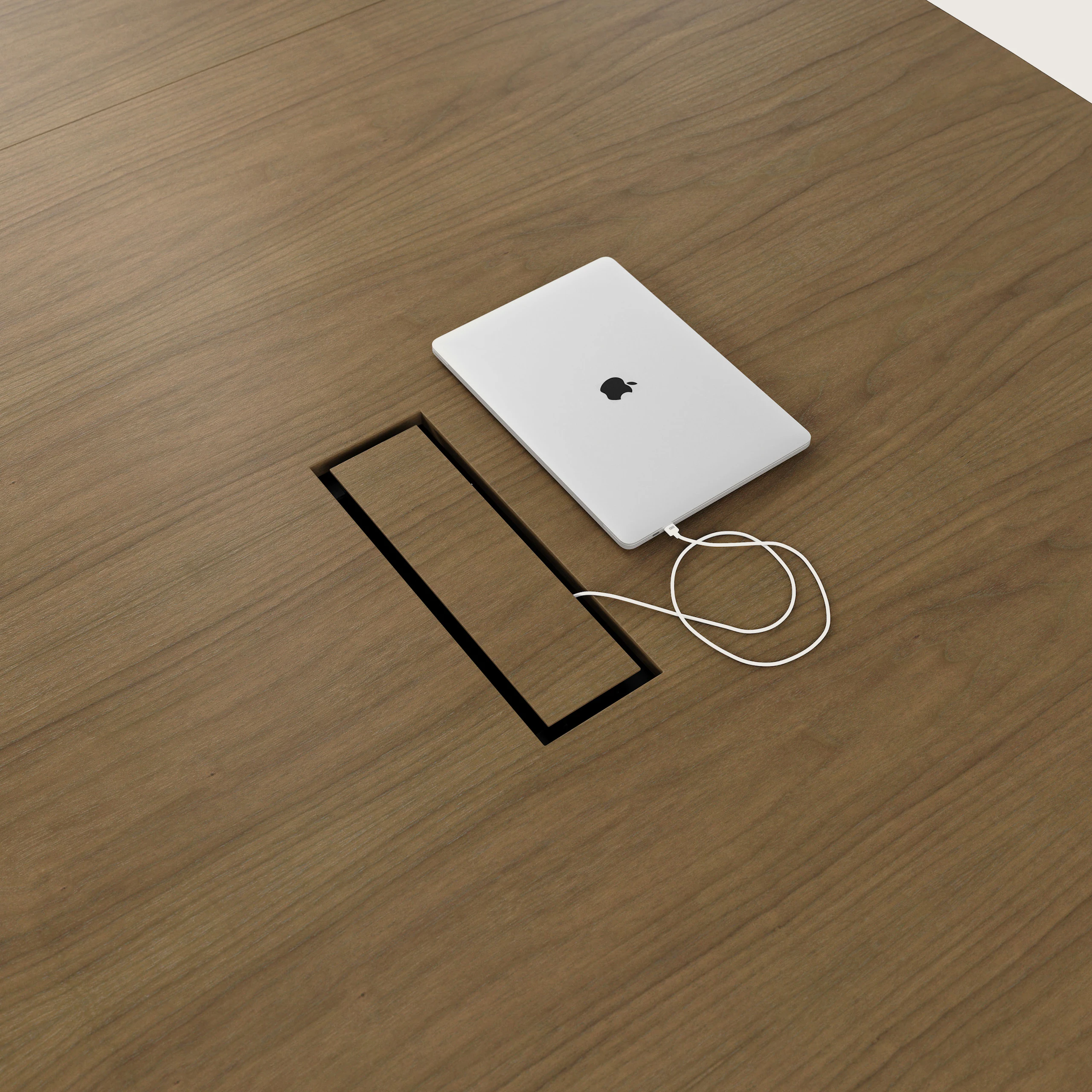 Detail shot of tabletop power access on a Highline Fifty Conference Table in Natural Flat Cut Walnut.