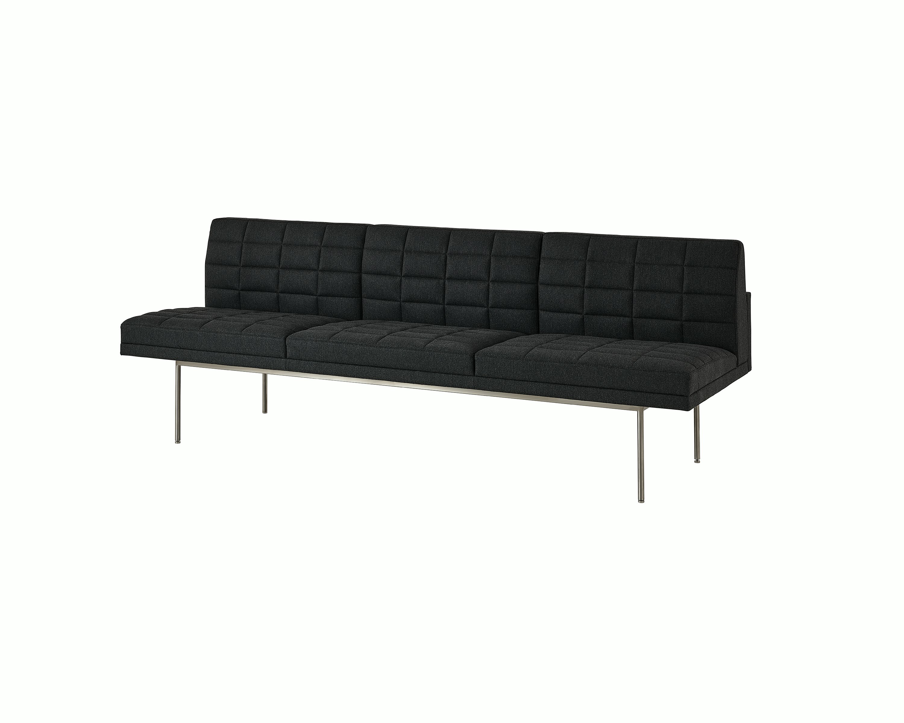 Tuxedo Component Sofa designed by BassamFellows upholstered in Bellano in Charcoal with a polished chrome base, shown at an angle on a white sweep.