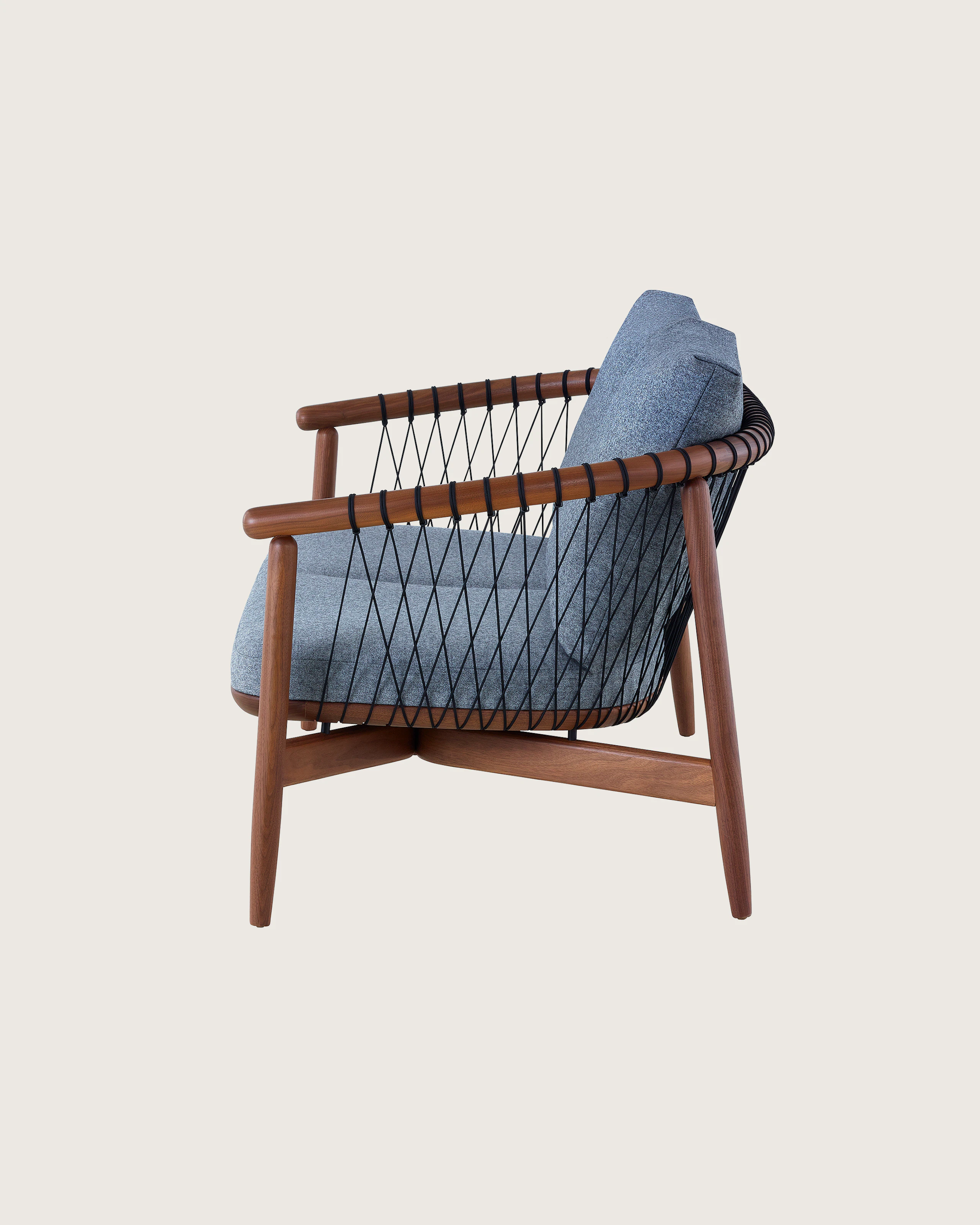 A dark-colored Crosshatch Settee featuring gray upholstery and a walnut frame. Viewed from the side.