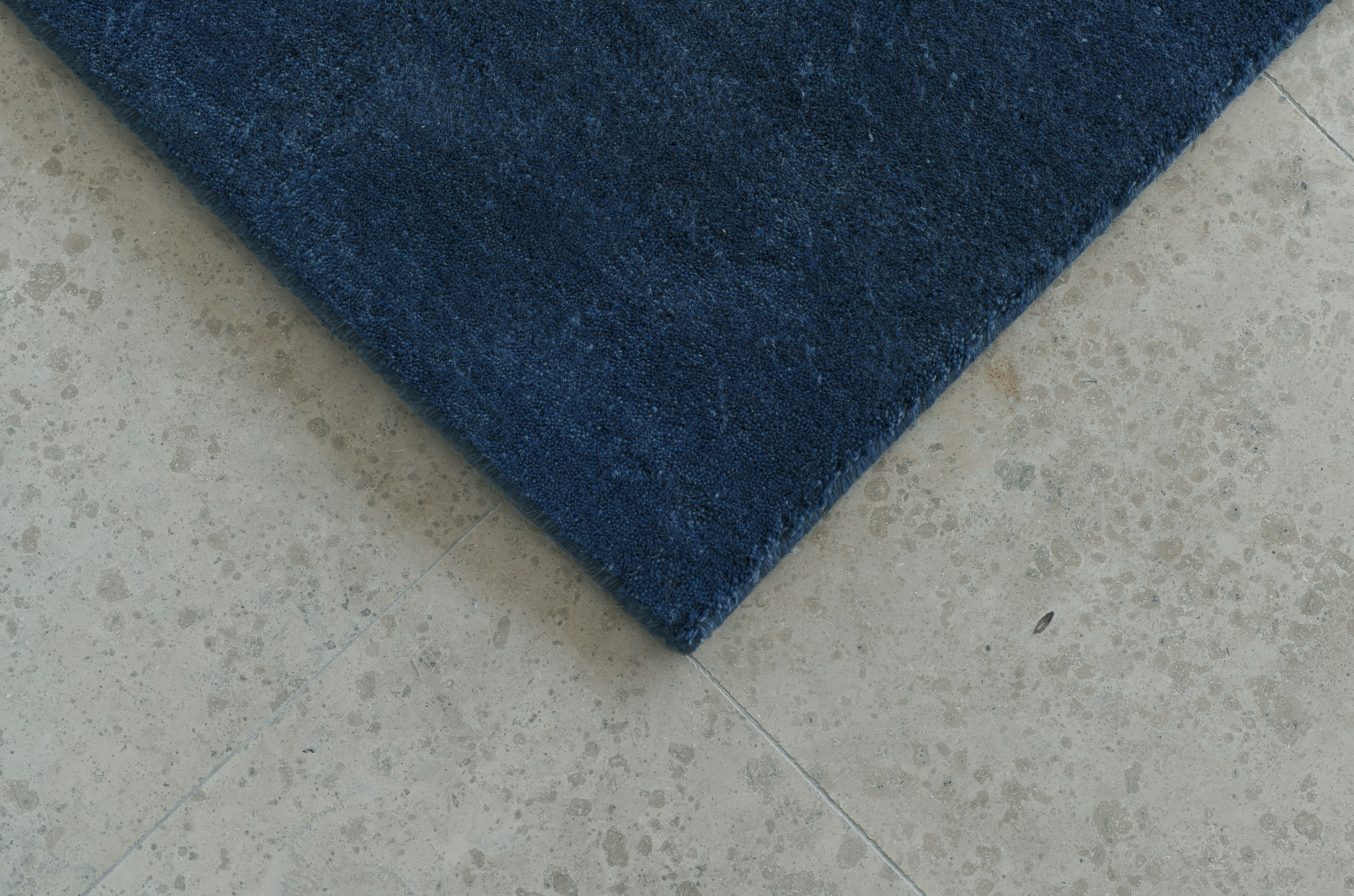 An environmental shot of the Grand Rug in Deep Blue.
