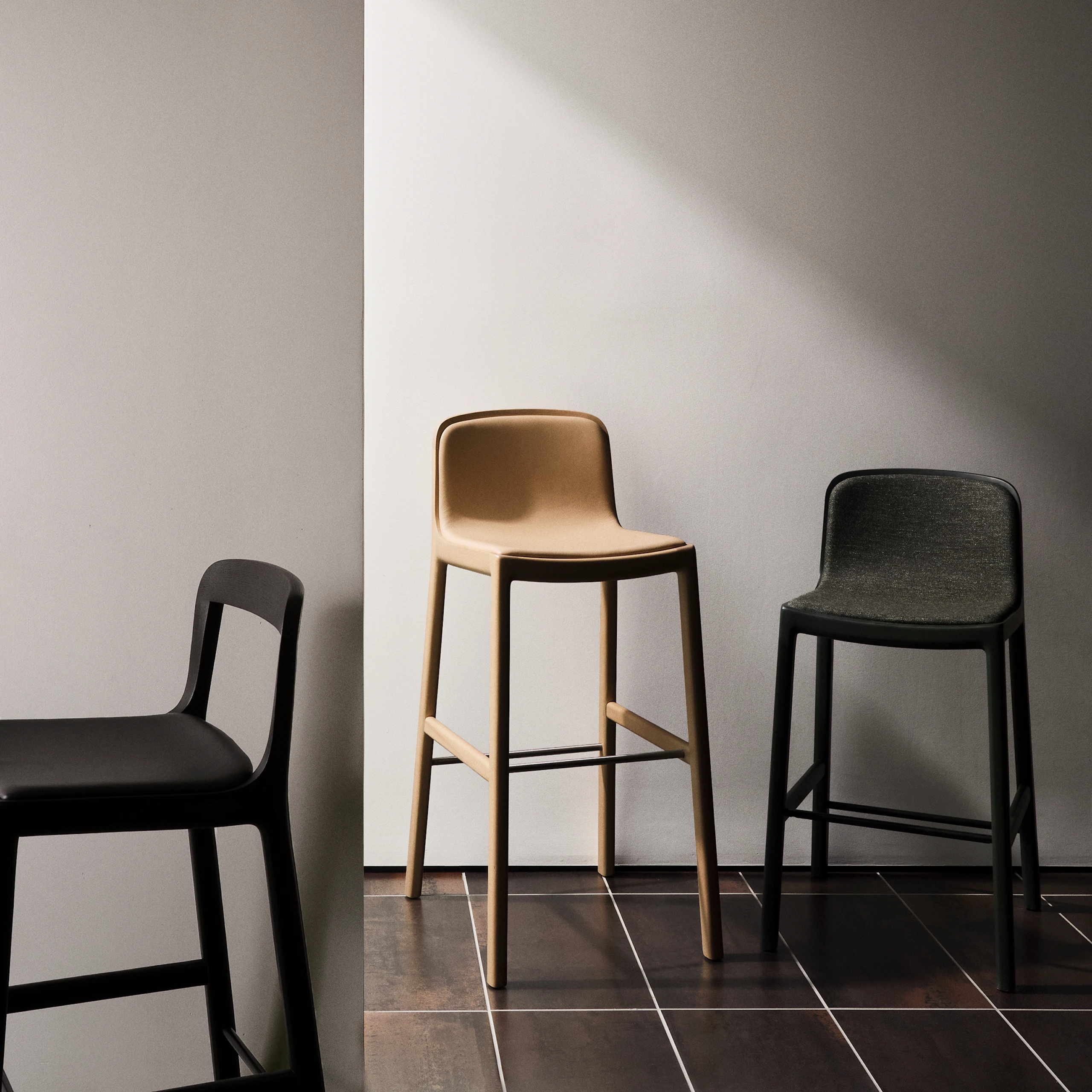 Lijn Stools in Bar and Counter-Heights designed by Carole Baijings for Geiger in a variety of wood stains, textiles, and leather upholsteries.
