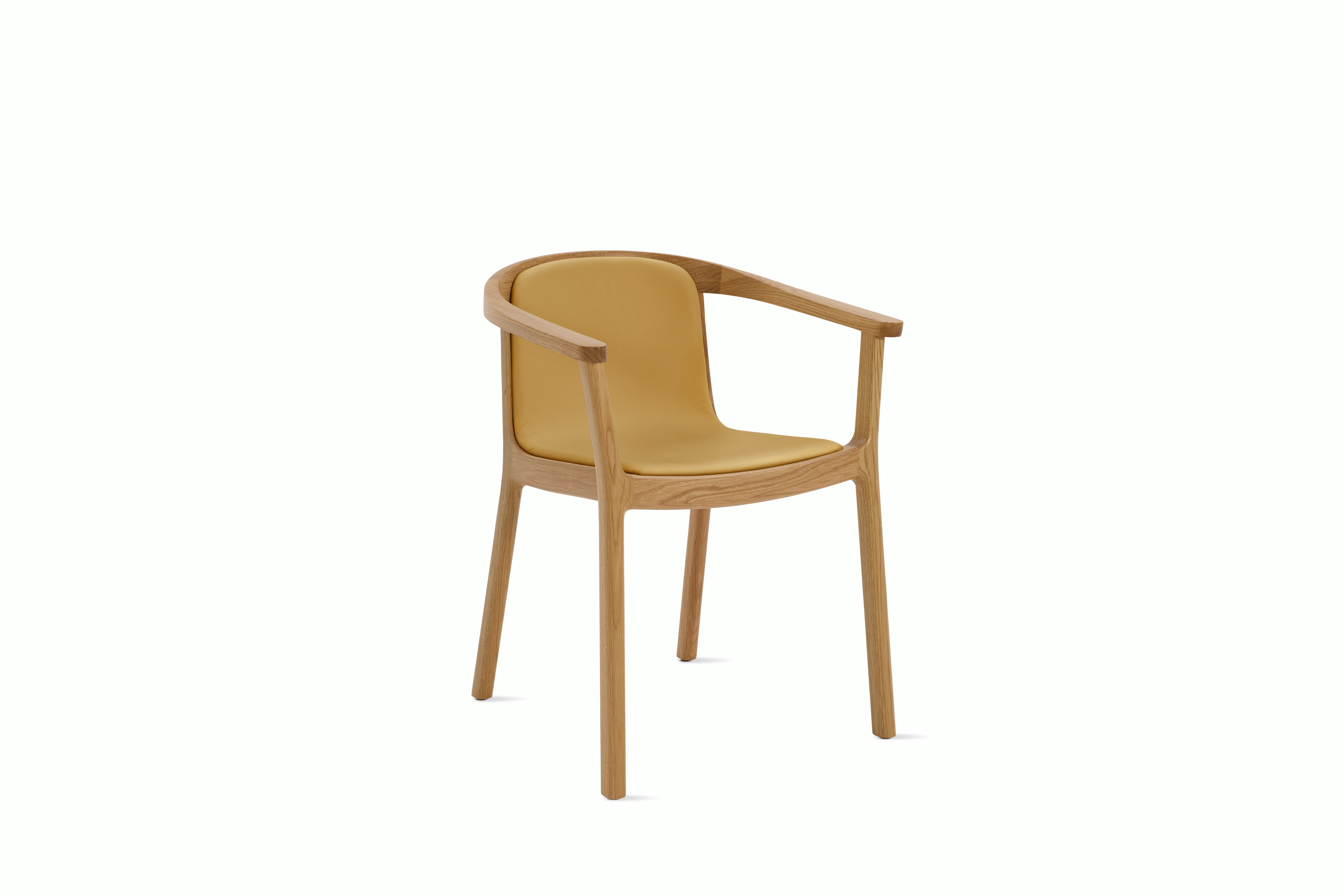 A Lijn Armchair in Yarrow Oak viewed from an angle.
