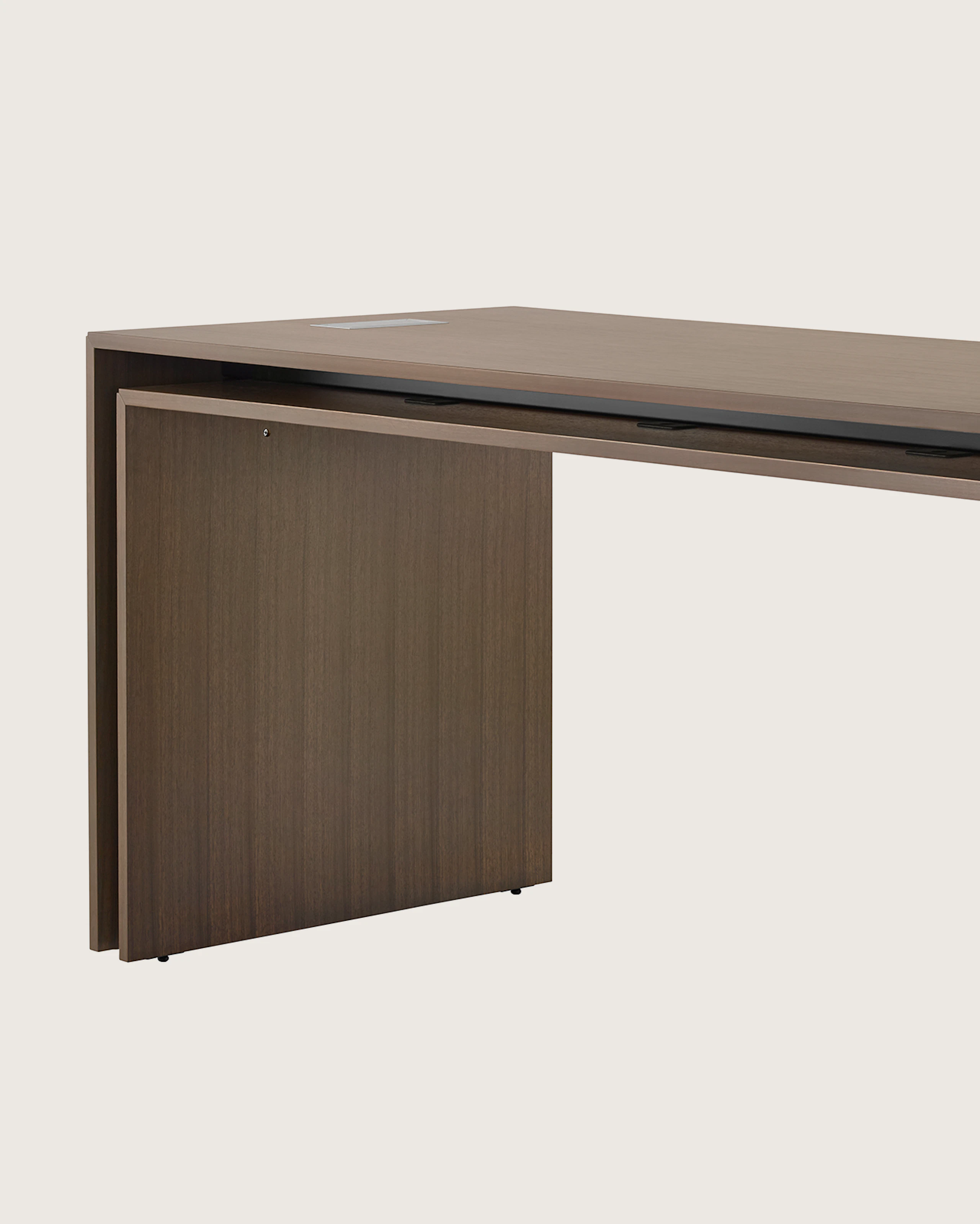 A rectangular Peer Table in a dark wood finish, viewed at an angle.