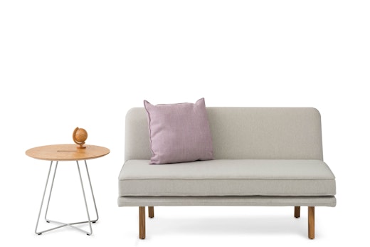 rockwell unscripted armless settee occasional round side table