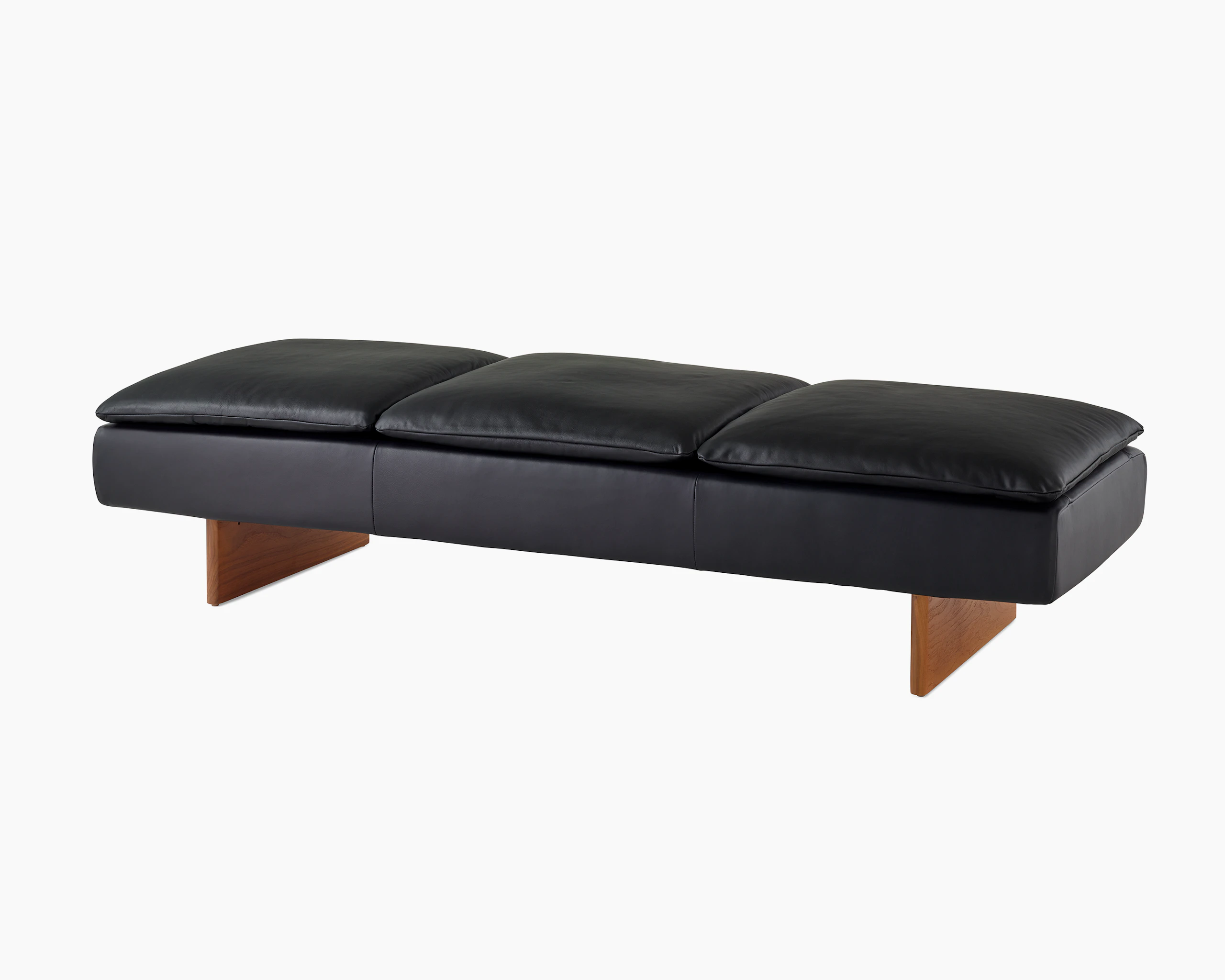 Mantle Three Seater Bench in black leather with a walnut base, viewed at an angle.